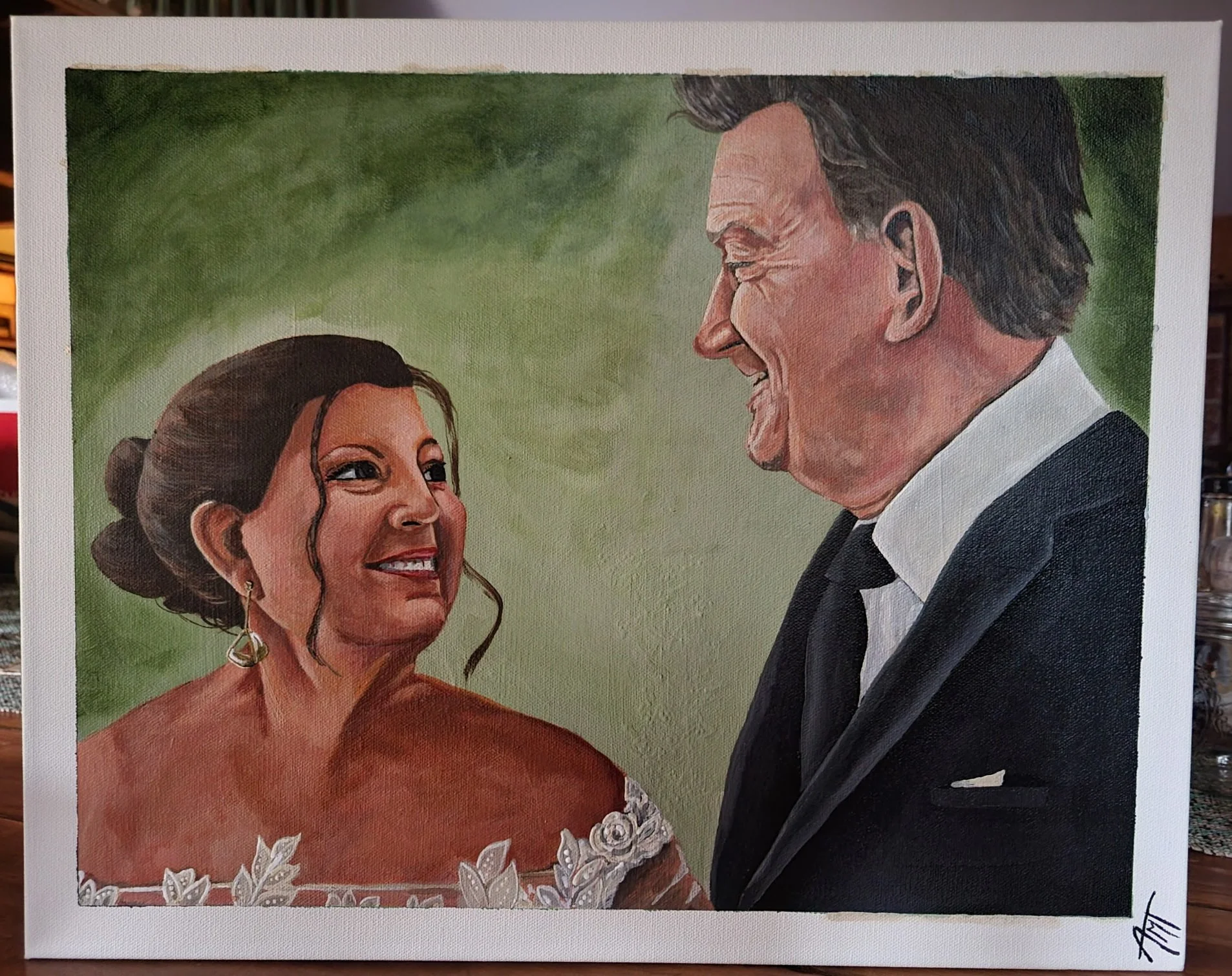 A painted portrait of a smiling woman in a red dress with white floral embroidery and jewelry, and an older man in a tuxedo with a white shirt, in front of a green background.