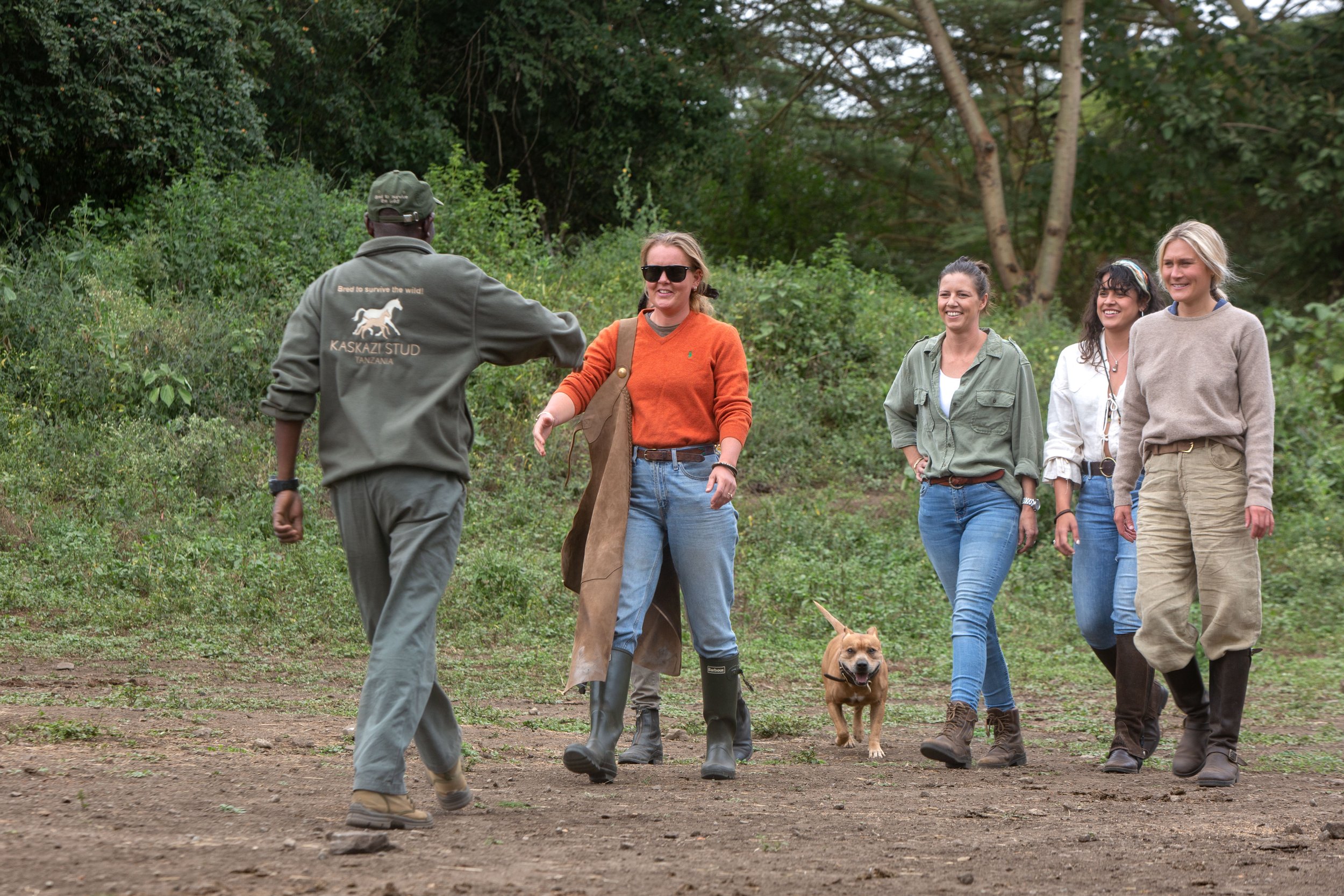 Guests walking to the stables with a guide at Tanzania Horse Safaris