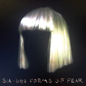 Black album cover of Sia's '1000 Forms of Fear' featuring a blond wig and black background with white handwritten text.