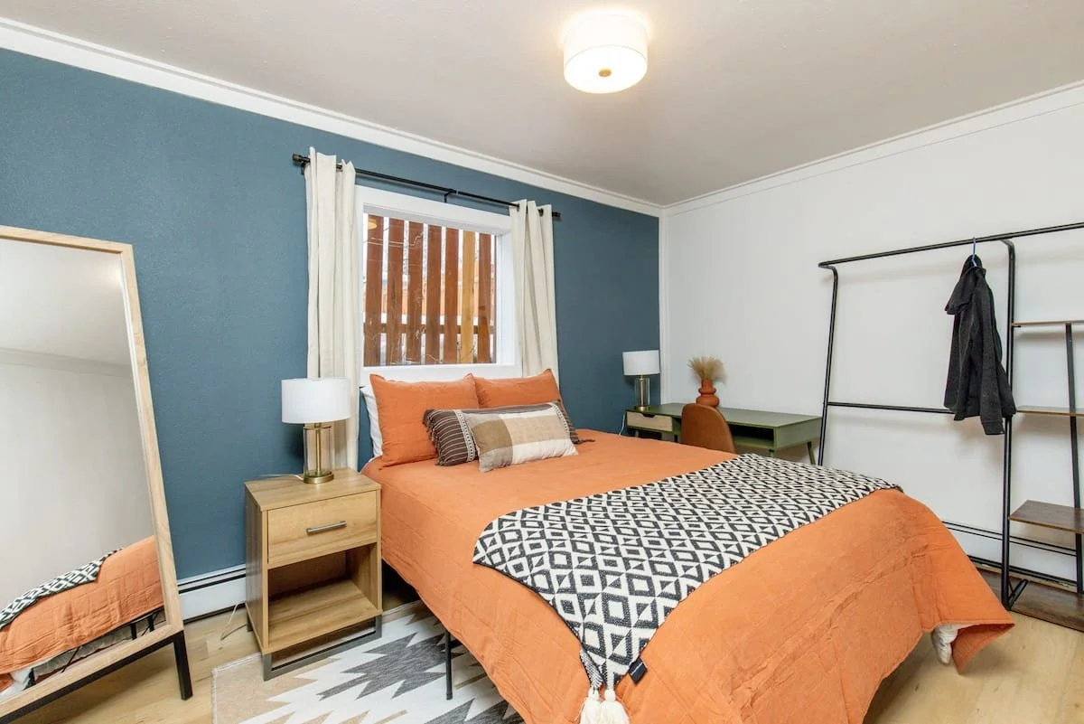 Renovated and furnished bedroom at Iowa Flats, a ten-unit multifamily property in Anchorage, Alaska.