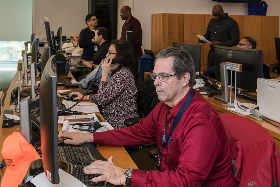 Public health coordination team working in an operations center