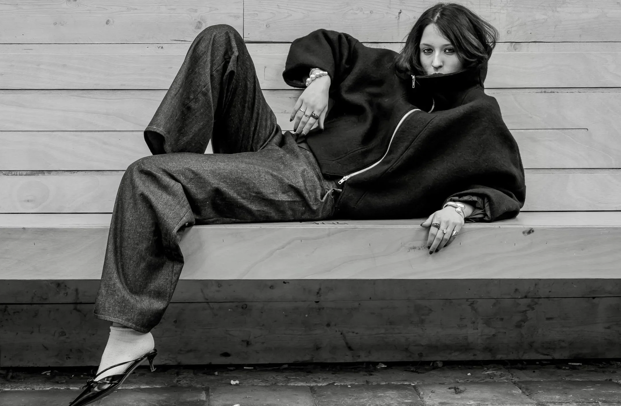 Model posing on bench with the jacket