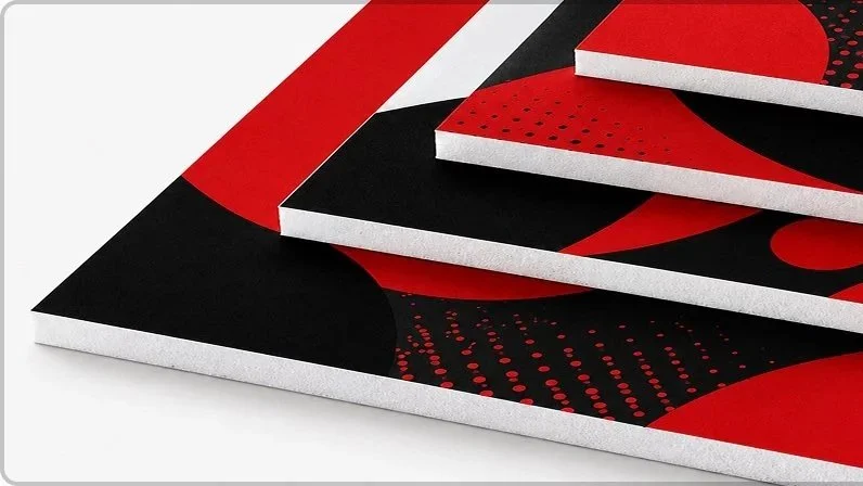 Close-up of black and red abstract printed foam panels with a geometric design.