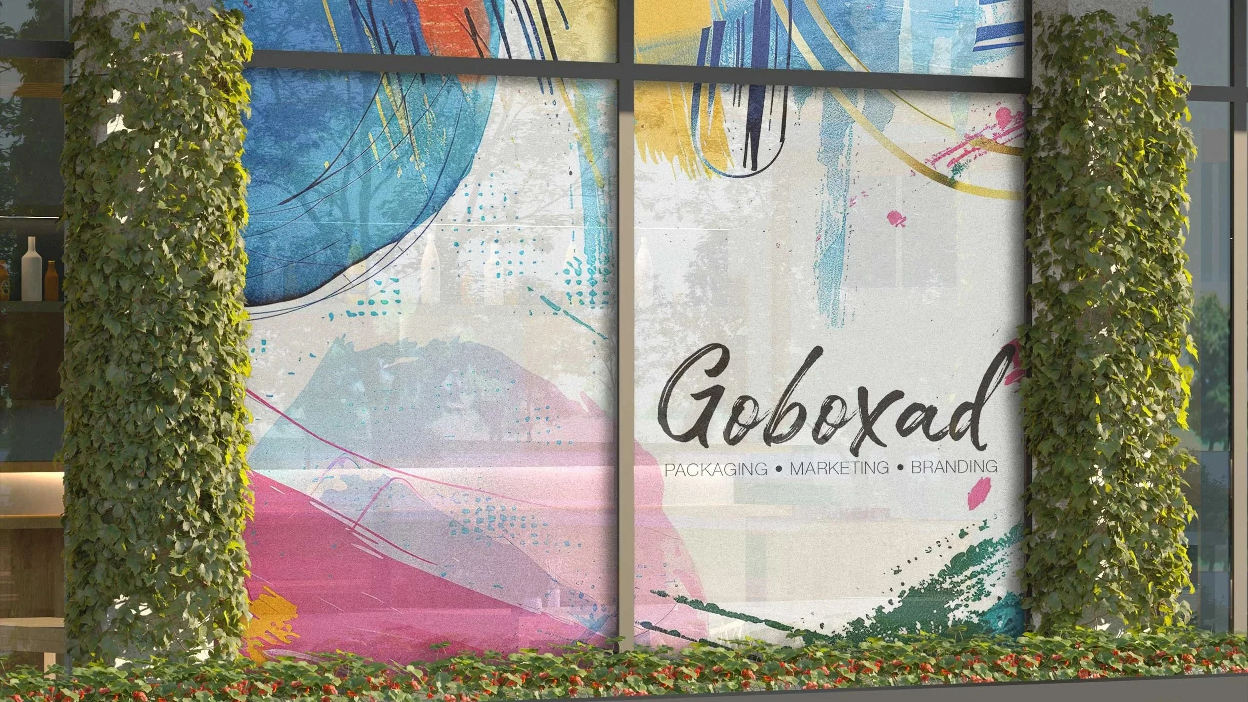 Colorful abstract mural with the words 'Goboxd' and 'Packaging, Marketing, Branding' on a window, framed by green leafy plants on both sides.