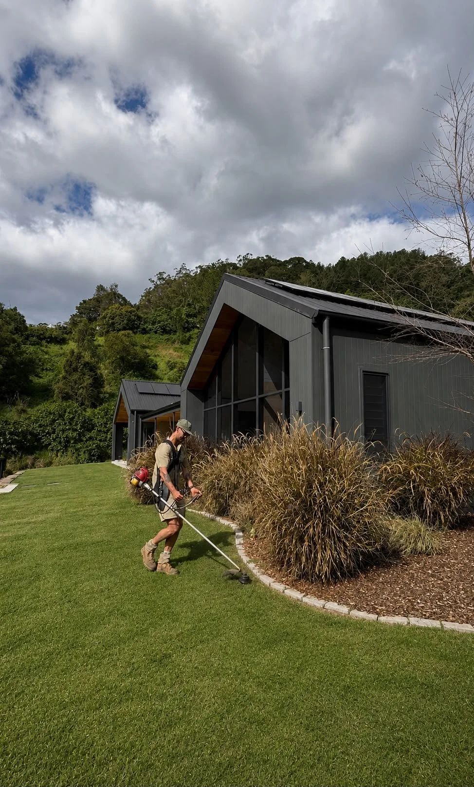 Difficult-access property maintenance using EWP equipment on a Gold Coast property