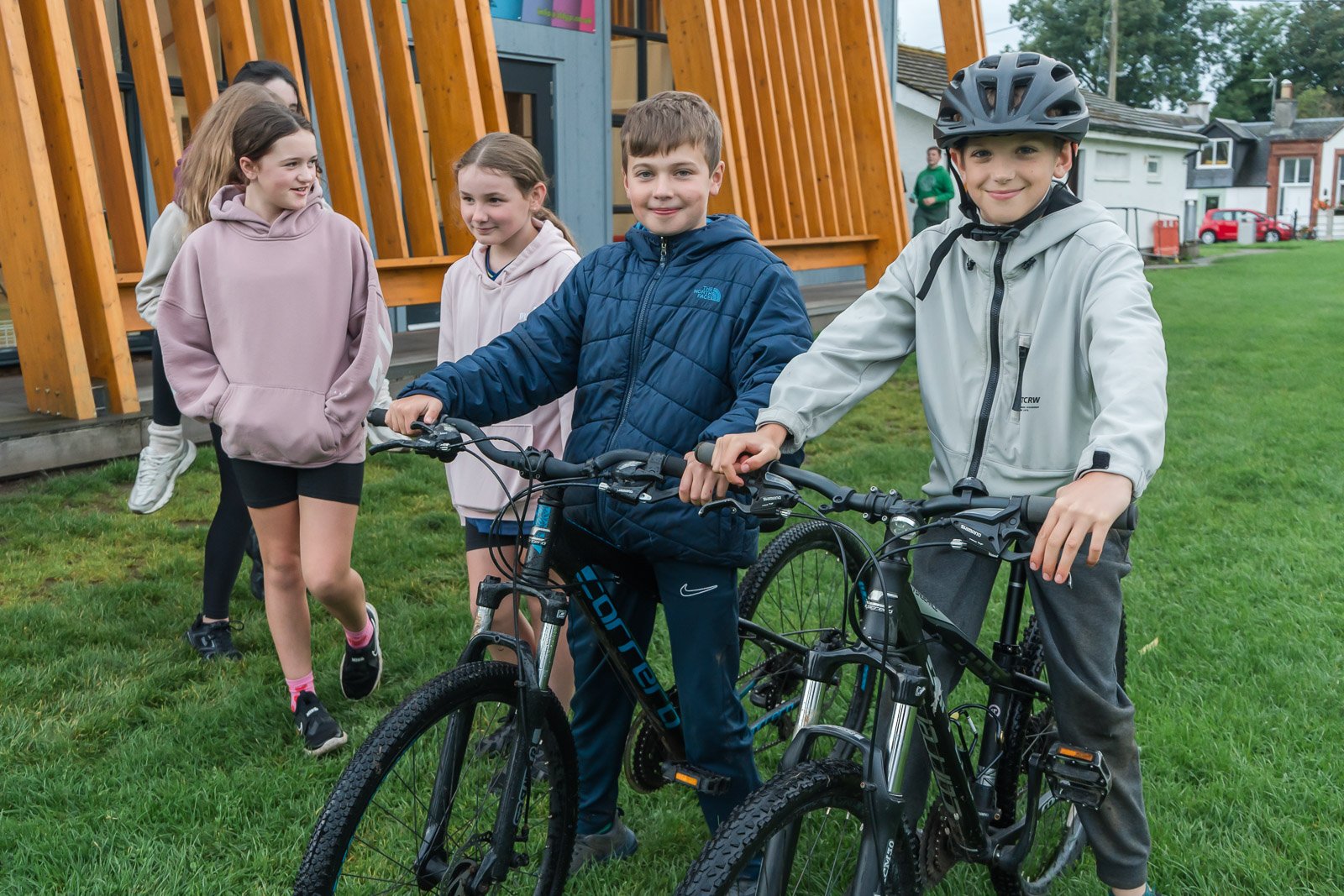 A group of children outdoors enjoying youth club at the DDYP at their pavilion in Doune.