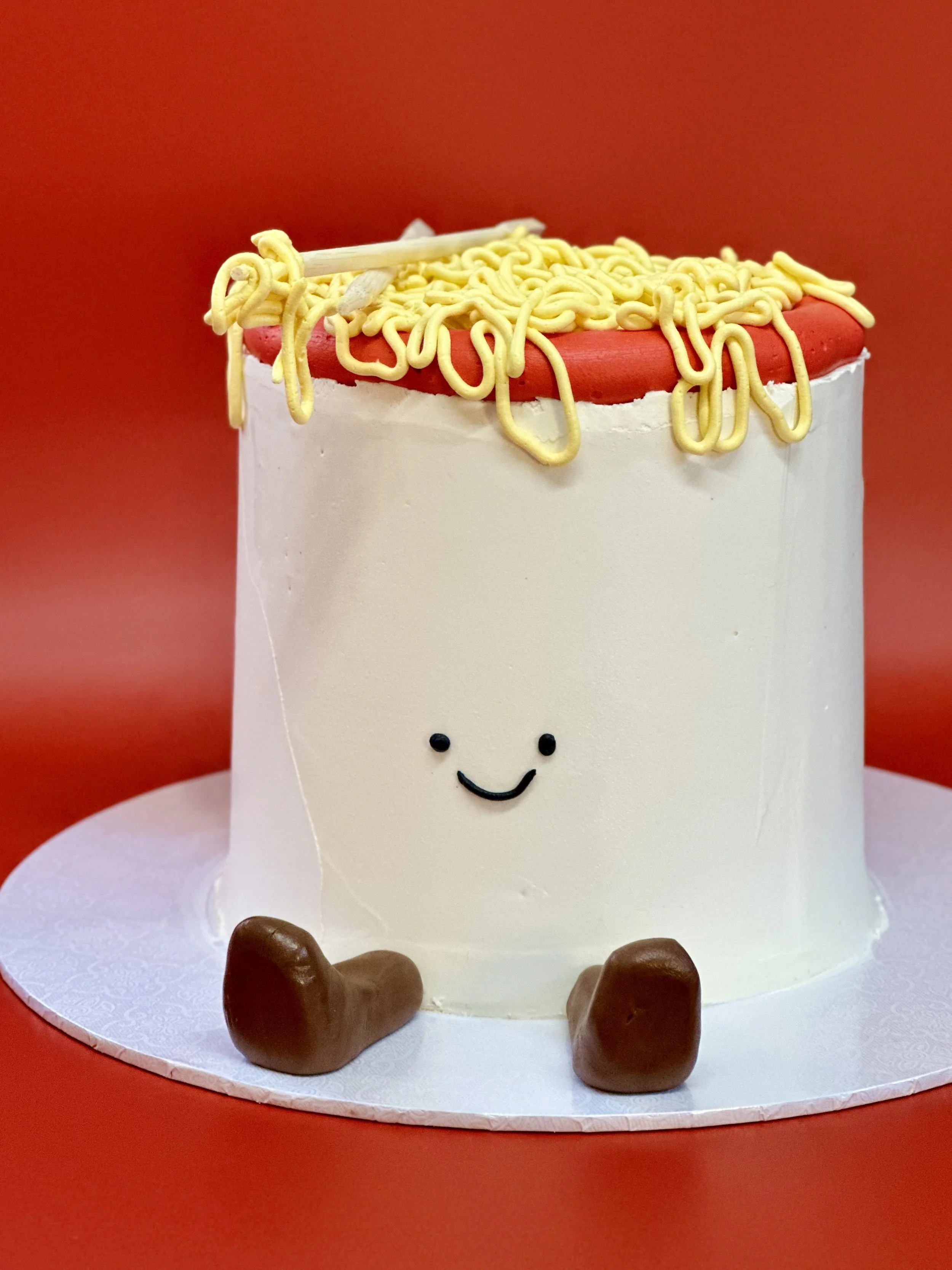 Would you believe this one isn't even cake but four giant stacked cookies? A custom design means you can have what you want and don't like cake? No problem!