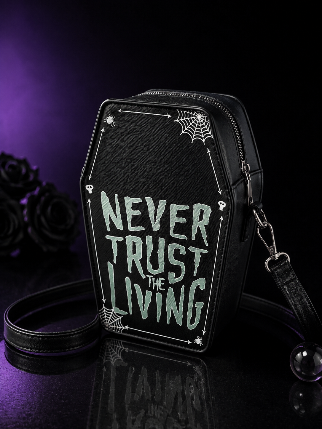 Never Trust the Living” Coffin Crossbody Bag