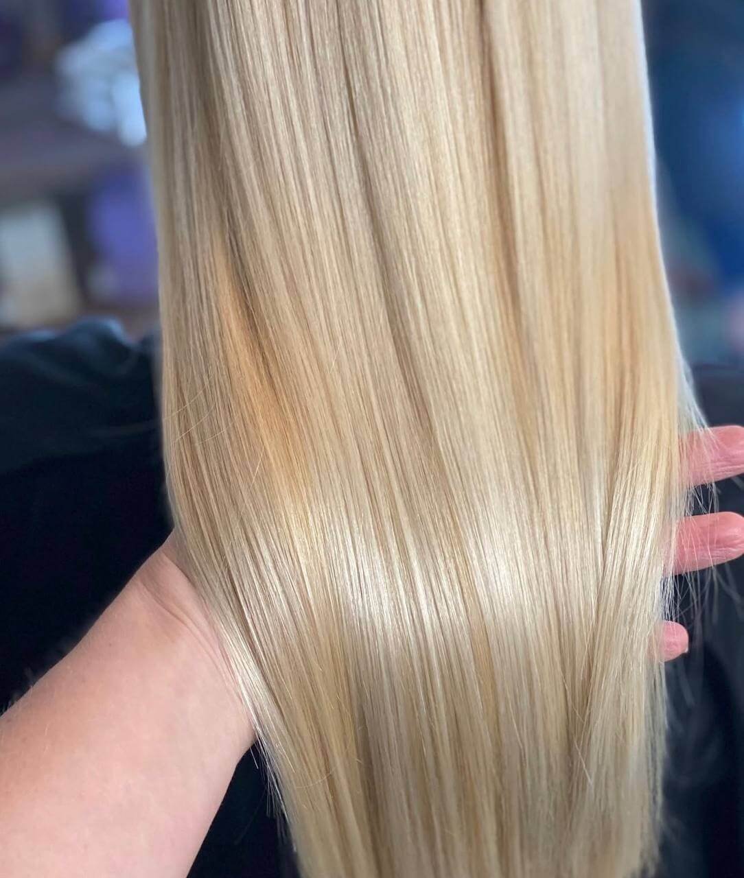 Blonde makeover by Olena with refined tone, dimension, and polished styling.