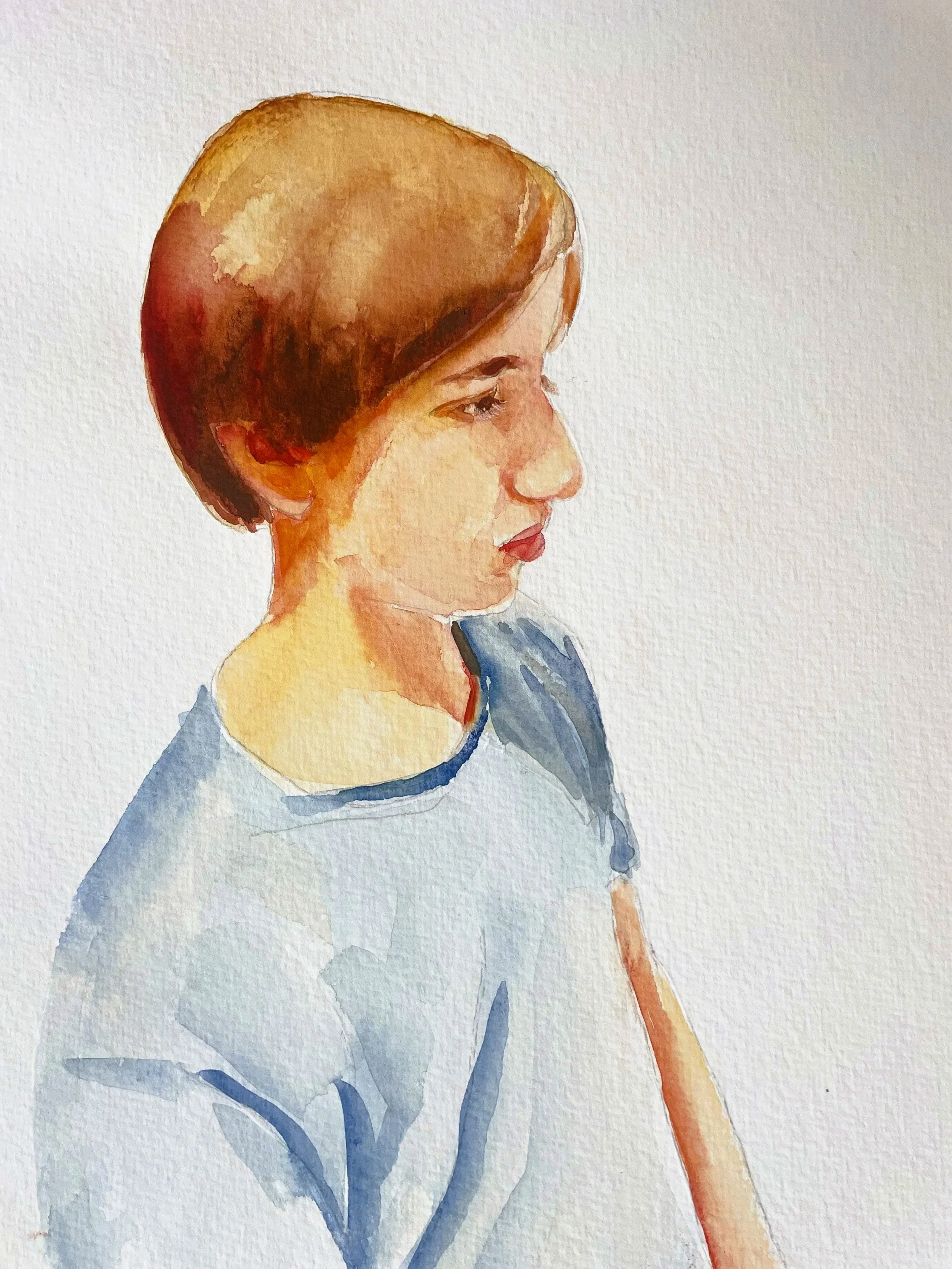 Watercolor portrait of a boy with short brown hair, wearing a light blue top, looking to the right.