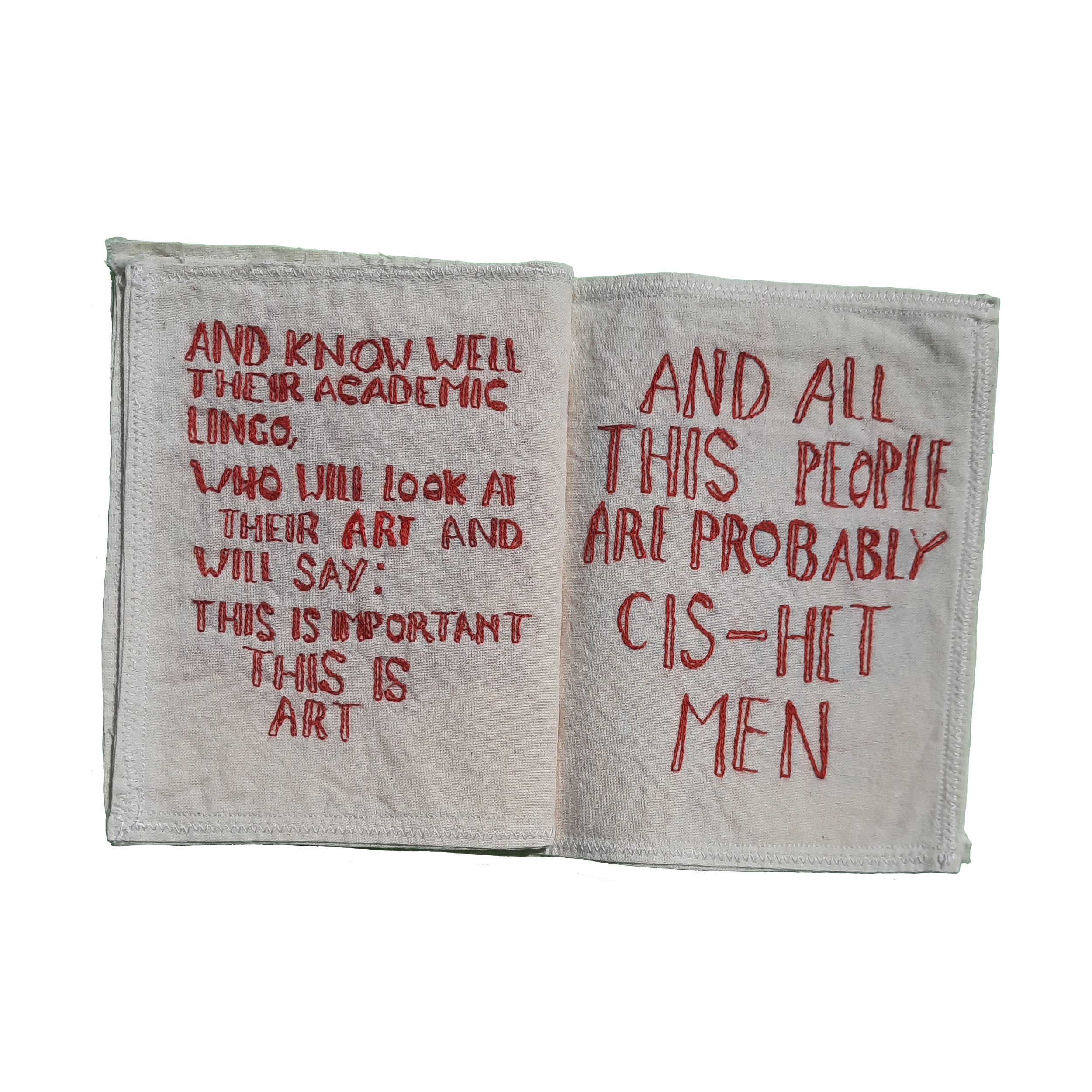 Close-up of fabric with embroidered red text.
