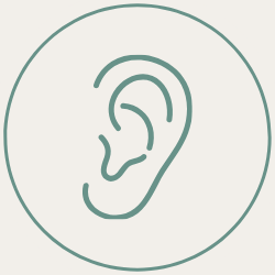 Outline of a human ear inside a circle.