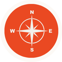 Red circular background with a white compass rose showing north, south, east, and west directions.