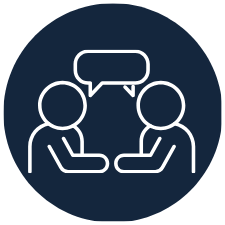 Two outlined figures sitting across from each other with a speech bubble above, representing a conversation or discussion.