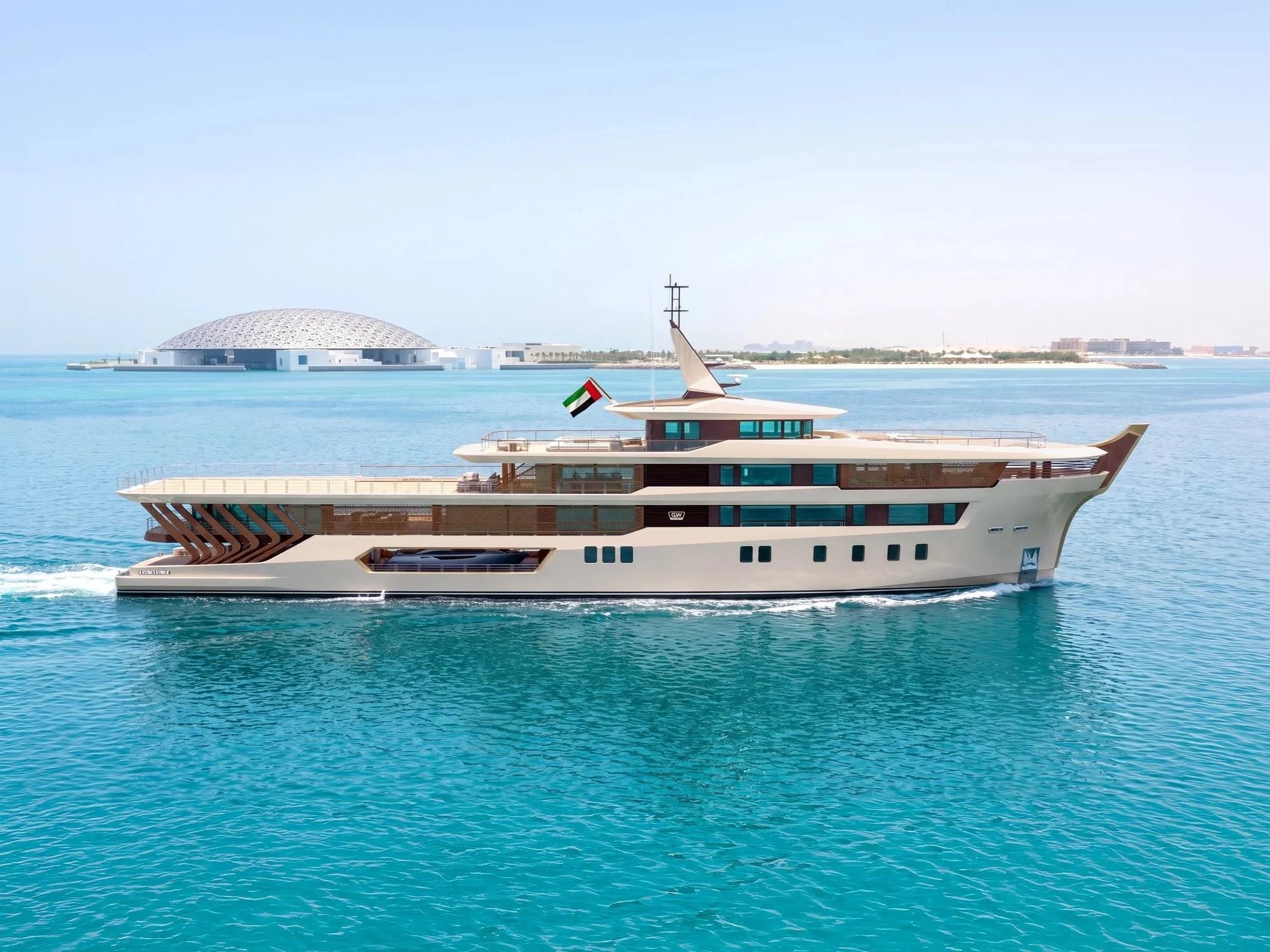 A luxury yacht with a modern design floating on clear blue waters near a city shoreline with buildings and a large dome structure in the background.