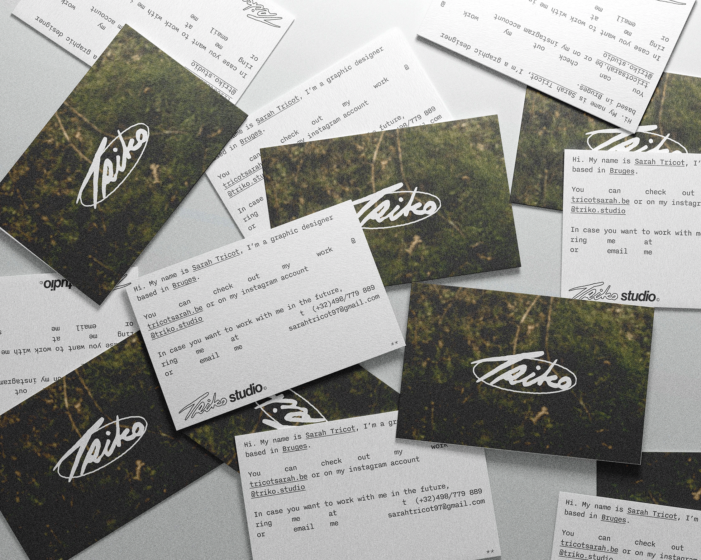 Multiple business cards scattered on a surface. The cards feature a green, nature-themed background with white cursive logo and black text providing contact information for Sarah Tricot, a graphic designer based in Bruges.