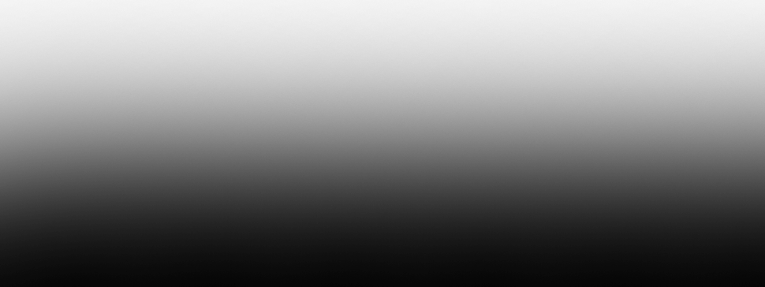 Black silhouette of a lion standing against a black background.