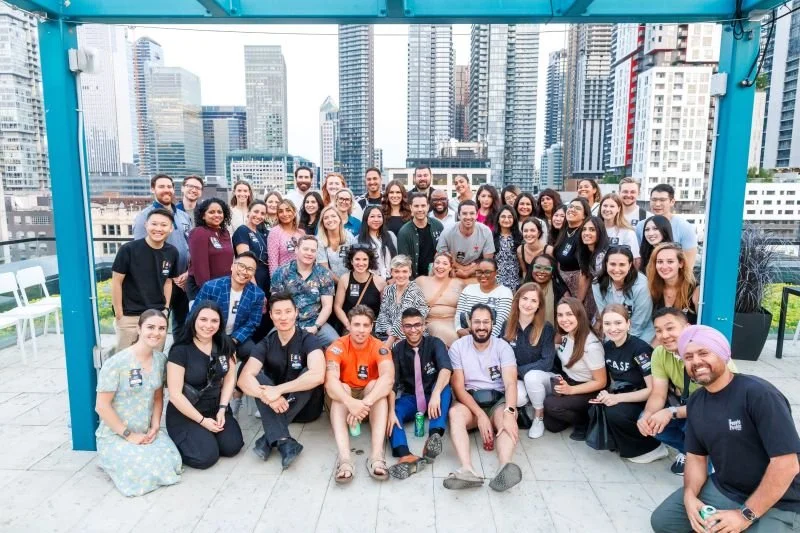 A group shot of a The People People Group meetup where ZJ beams from the middle right.
