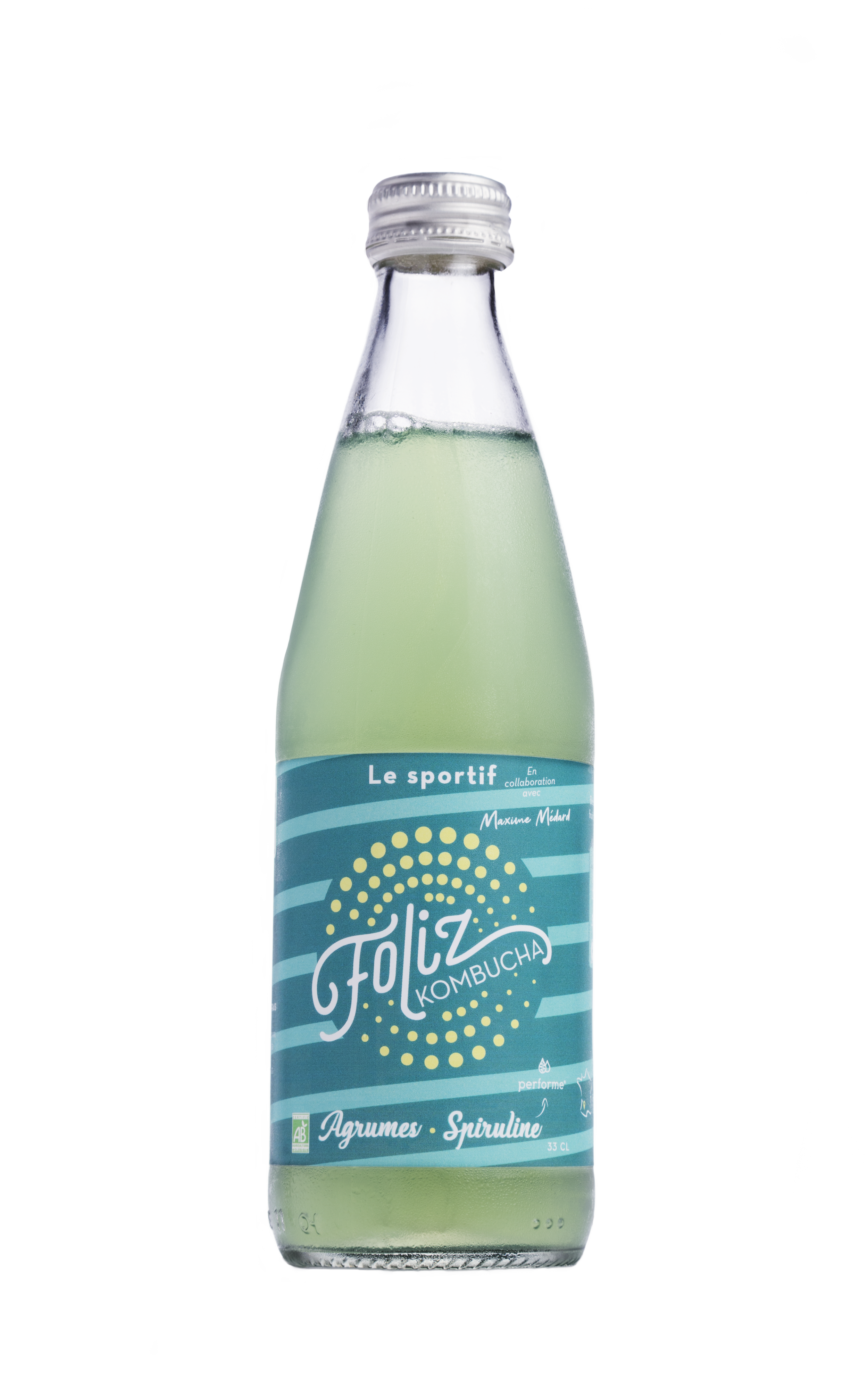 Bouteille de kombucha aux agrumes et spiruline, contenant une boisson verte, avec un étiquette bleue et blanche, la marque 'Foliz', 33 cl.