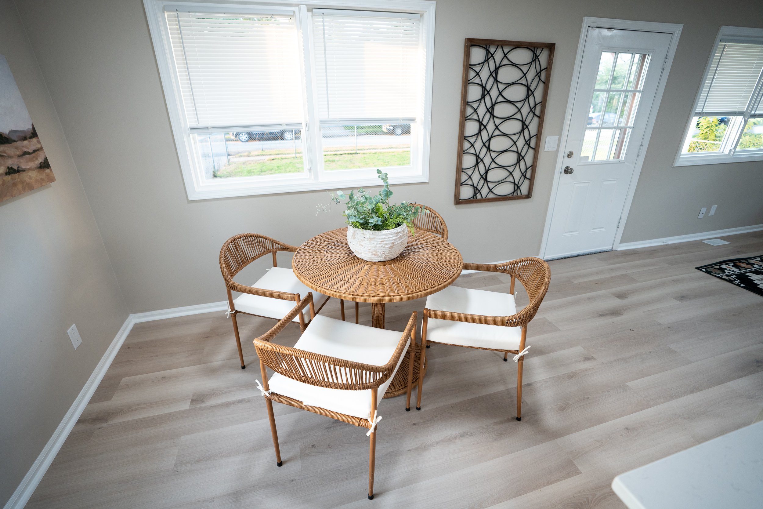 Clean dining room interior with table and chairs