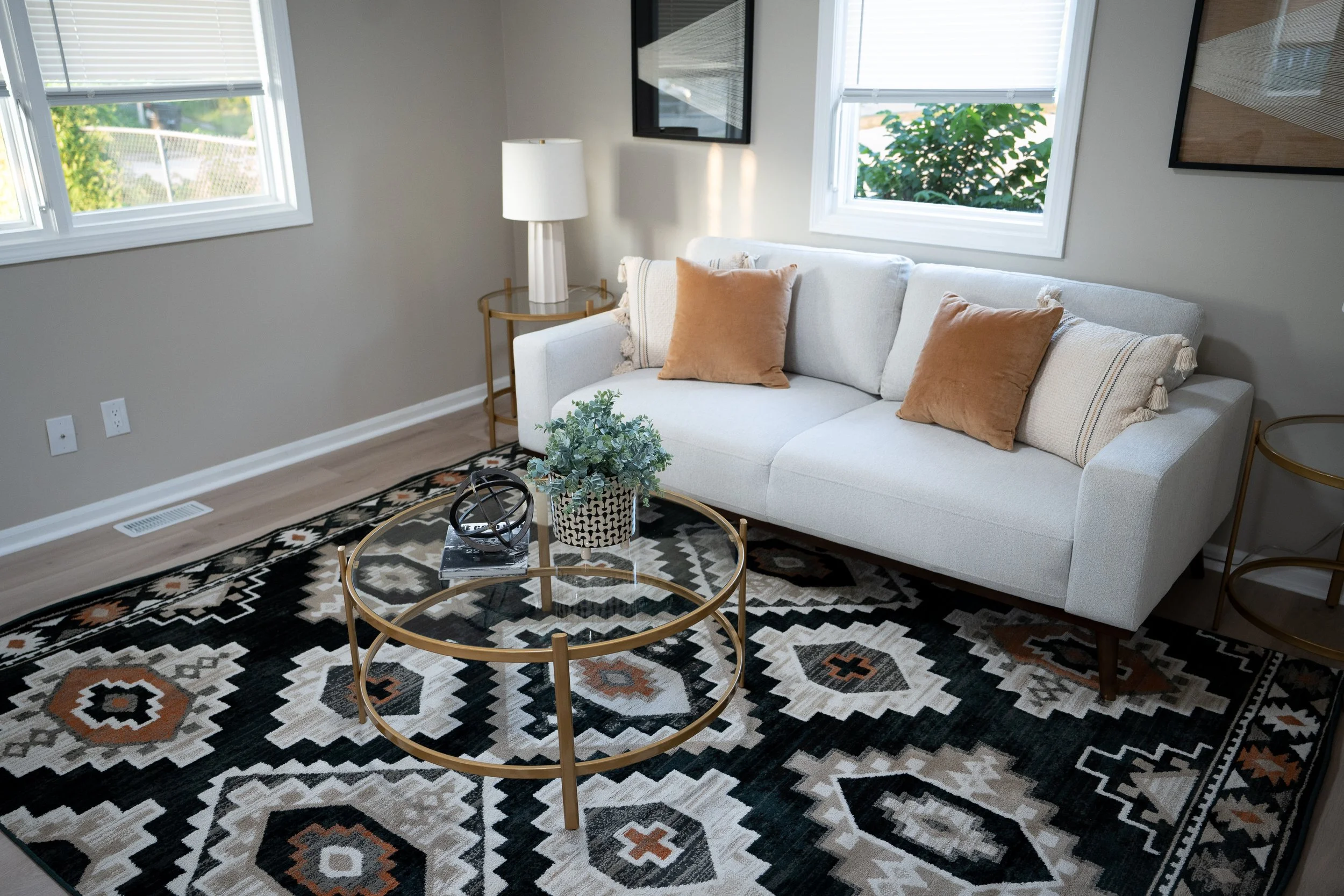 Interior photo of a modern living room with a styled coffee table.