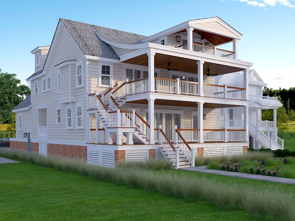 A large white three-story house with multiple balconies and stairs, set on a well-maintained lawn.