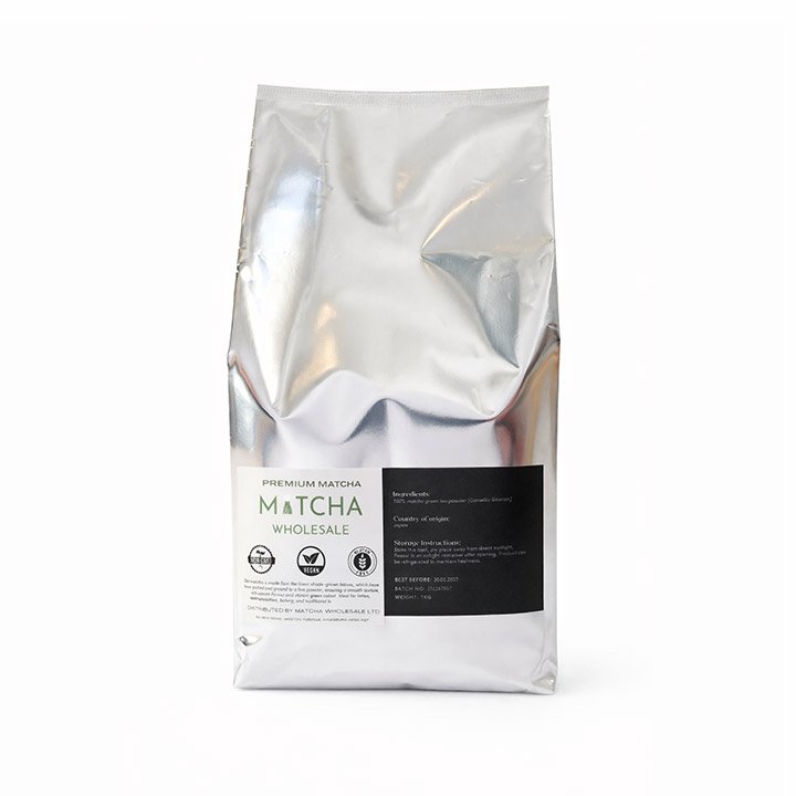 Silver package of premium matcha tea labeled 'Matcha Wholesale' against a white background.