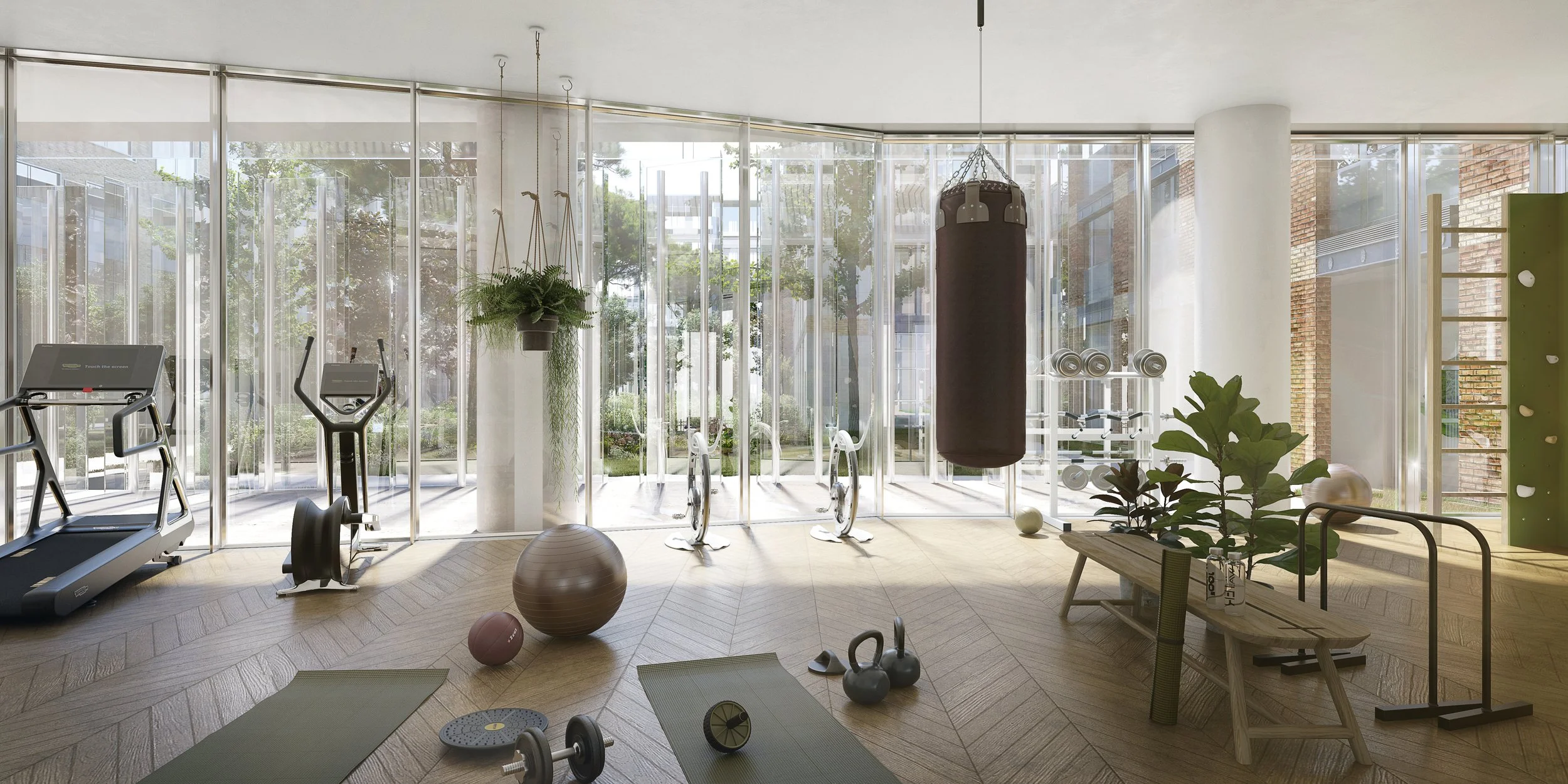 Salle de sport lumineuse avec tapis de course, vélo elliptique, sac de boxe, ballons de fitness, haltères, plantes vertes, et équipement de fitness, avec de grandes fenêtres laissant entrer la lumière naturelle.