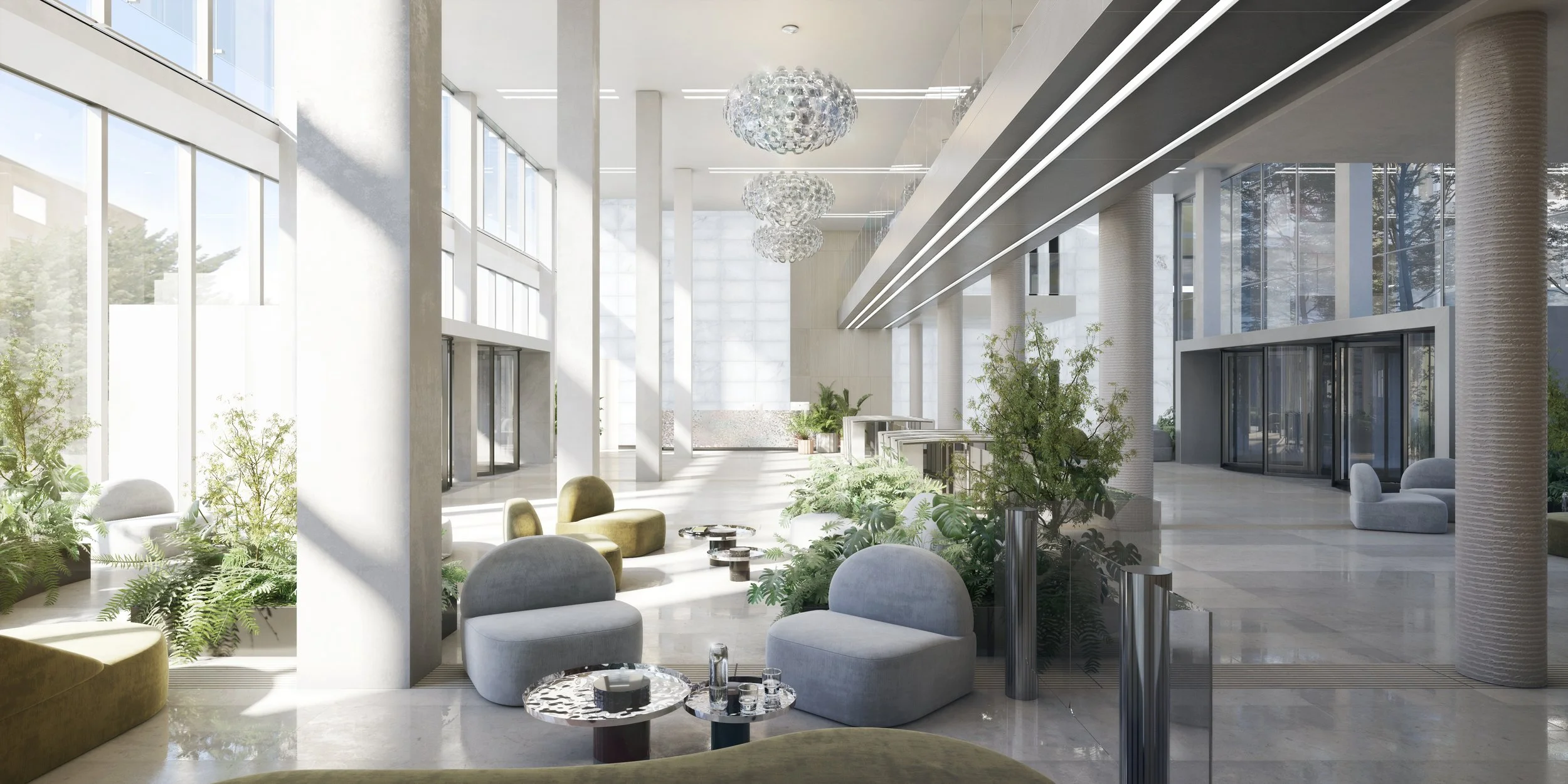 Hall d'entrée d'un bâtiment moderne avec beaucoup de lumière naturelle, mobilier confortable, et plantes vertes.