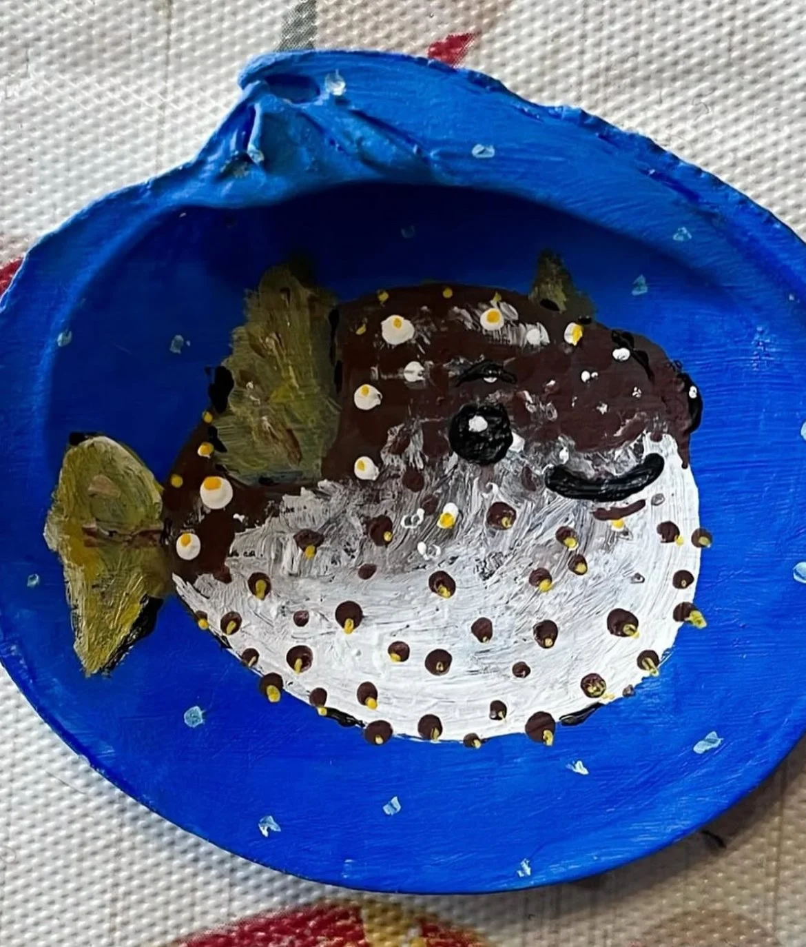 Small acrylic painted shell of a pufferfish