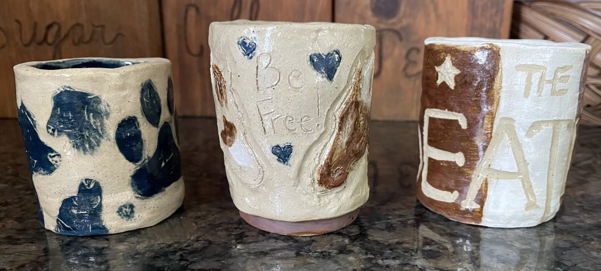 The front sides of the mugs
