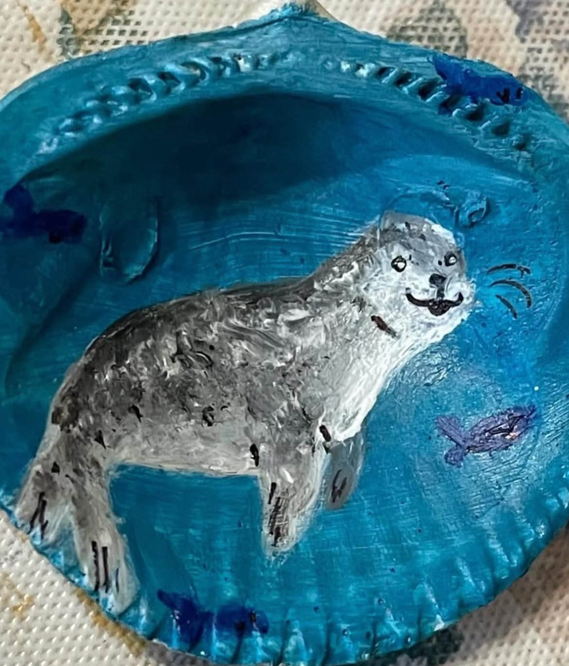 Small acrylic painted shell of a Leopard Seal