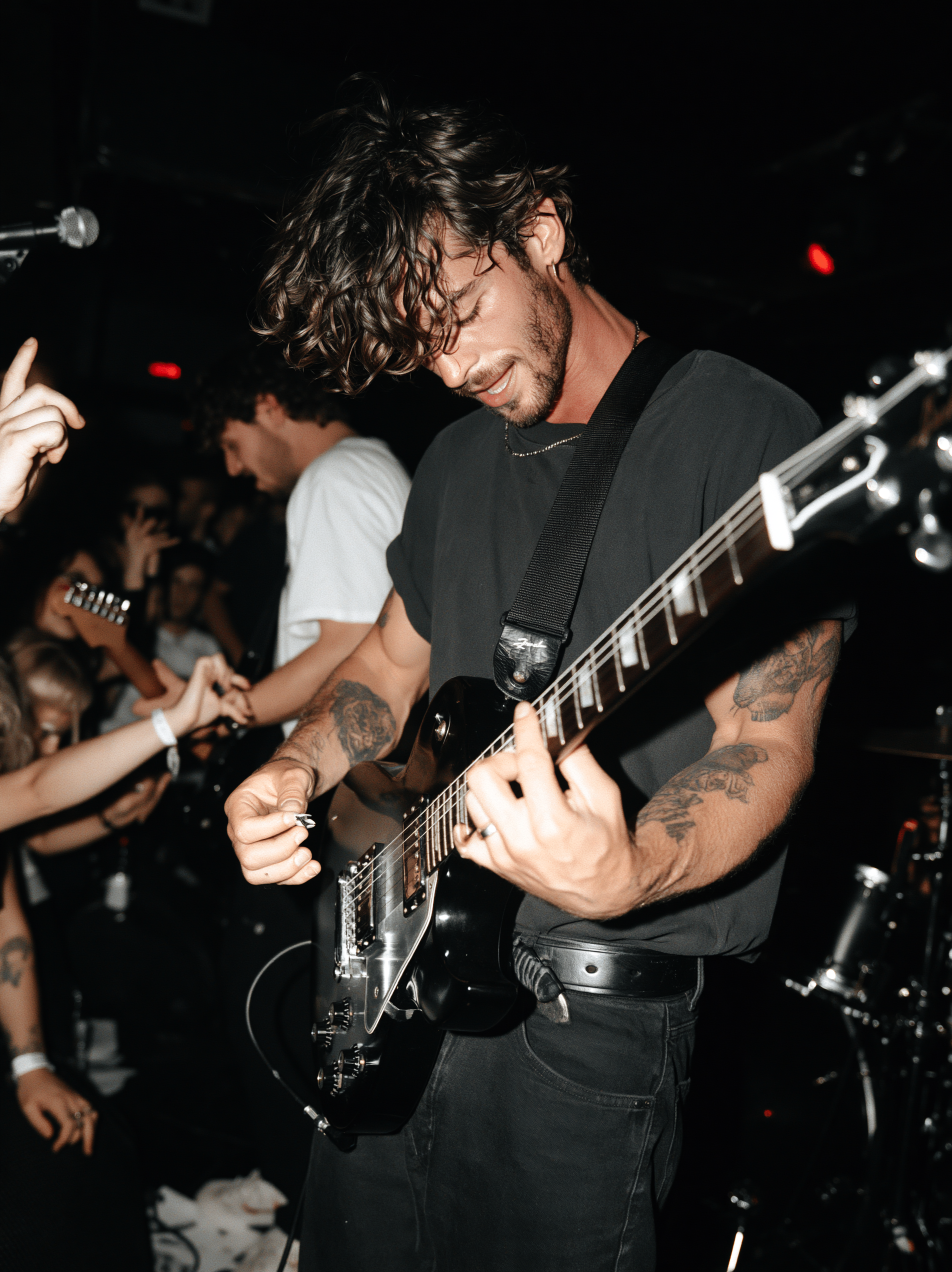 denise-renee_candid_photo_of_a_rockstar_playing_guitar_on_sta_acaffd47-fd60-410a-b043-f7a6d3ddeb8c_1.png