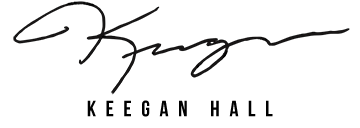 Black image with faint, cursive signature or writing