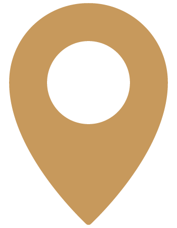 A beige map location pin icon with a black circle in the center.