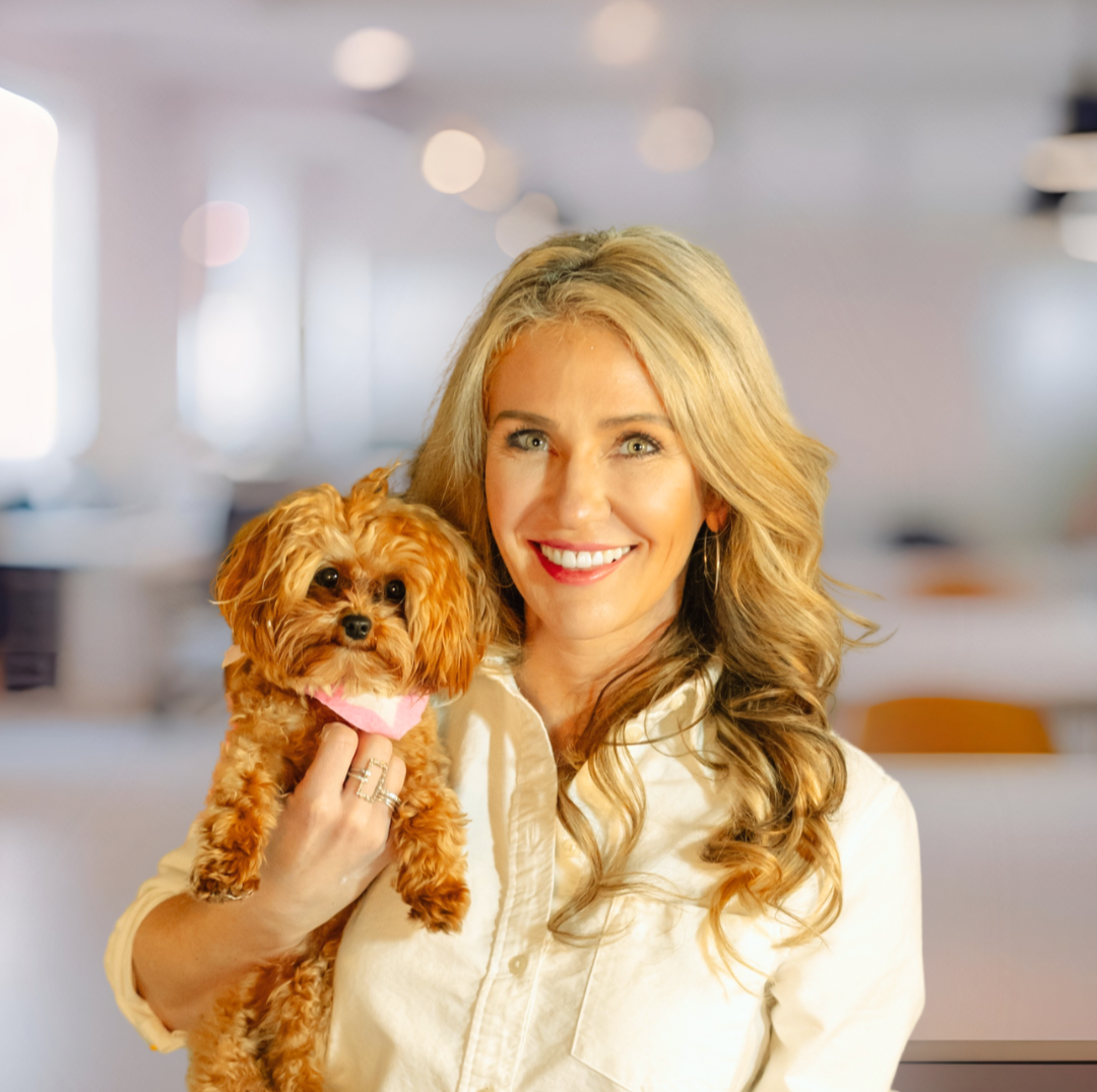 Contemporary abstract artist Courtney Davis Haze with her dog Twinkle in professional setting.