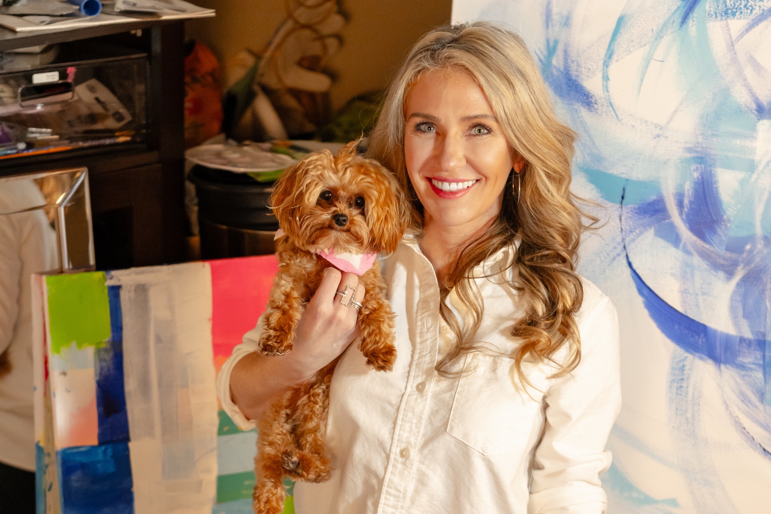 Contemporary abstract artist Courtney Davis Haze with her dog Twinkle in the studio.