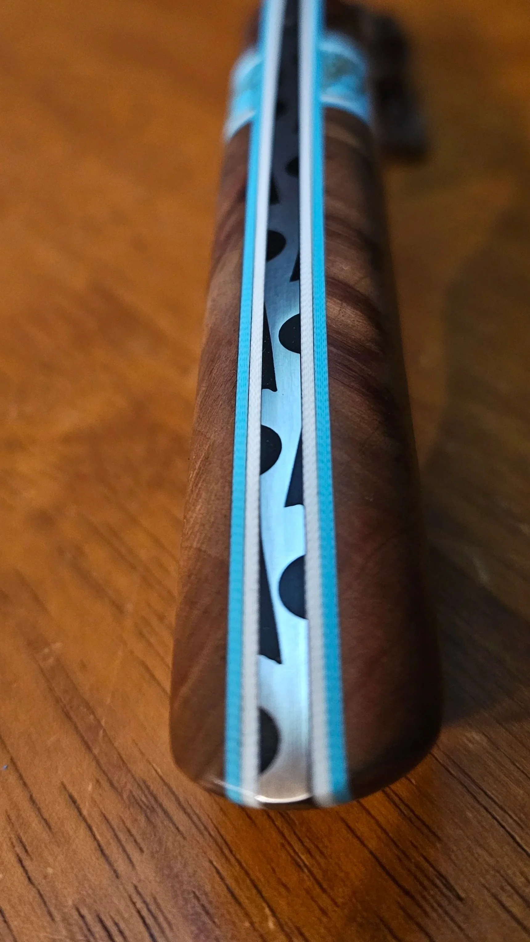 Close-up of decorative file work on the spine of a hand crafted knife