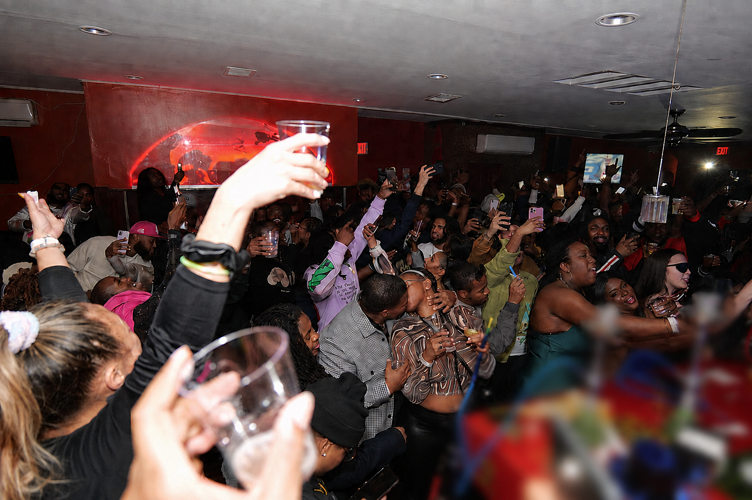 Crowd celebrating together at a high-energy OYEA nightlife event in Washington, DC.