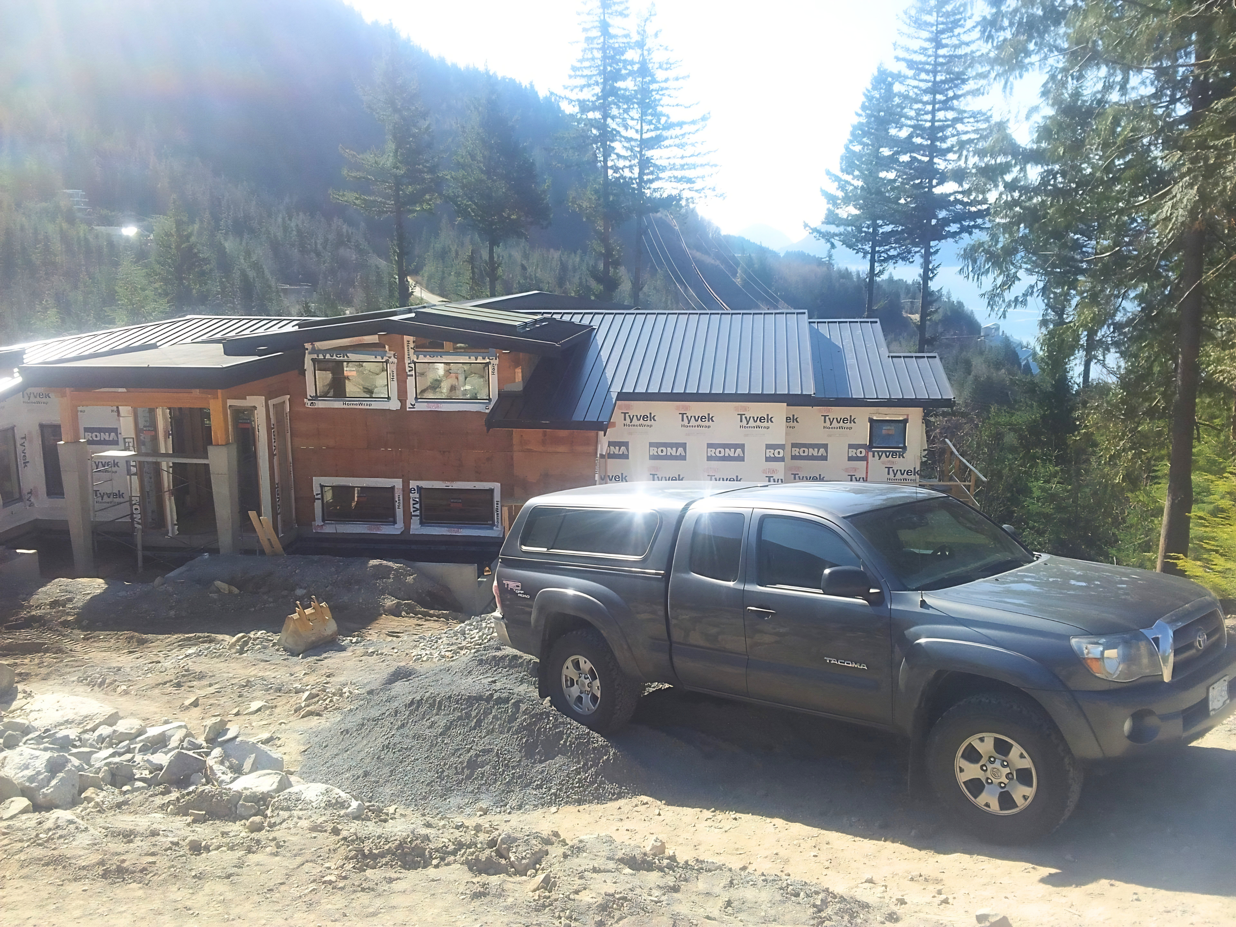 Home addition under construction with house wrap and framing in Squamish