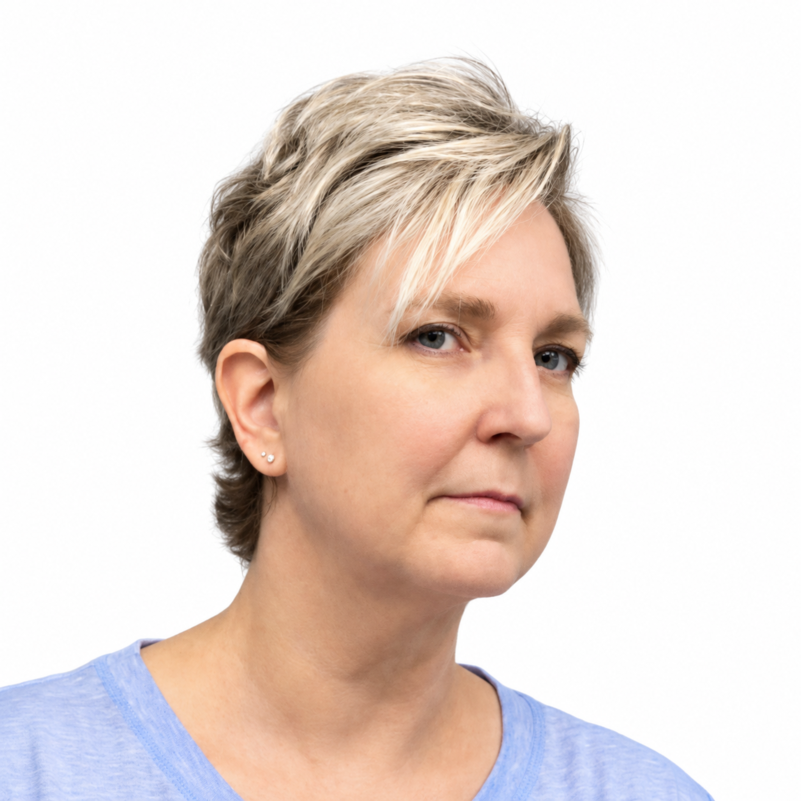 Close-up of a woman with short blonde hair, blue eyes, and a light blue top, against a white background.