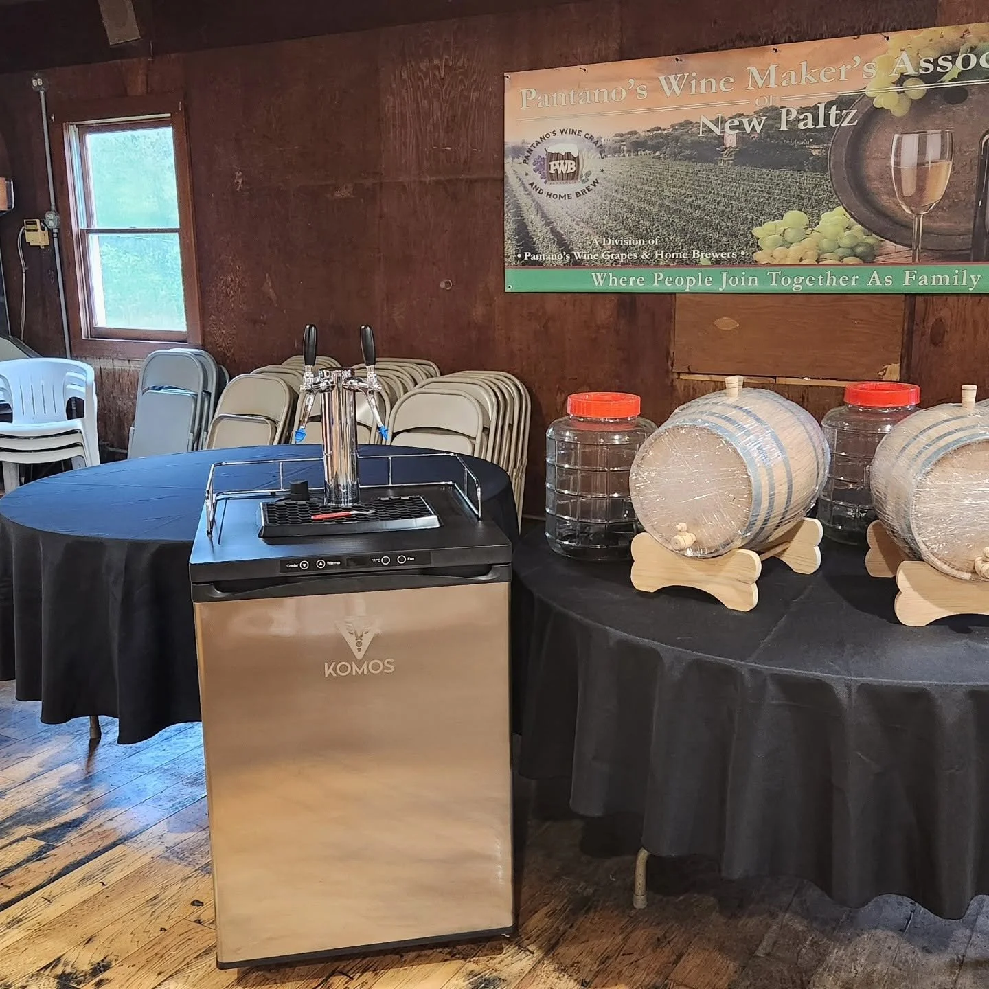 Small barrels and winemaking equipment displayed on tables at Pantano's