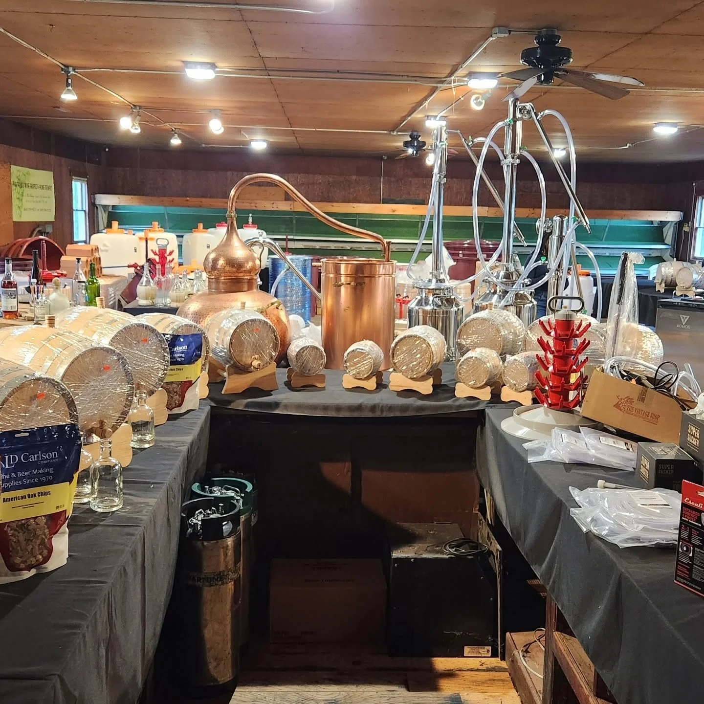 Distilling equipment, funnels, and barrels set up inside Pantano's