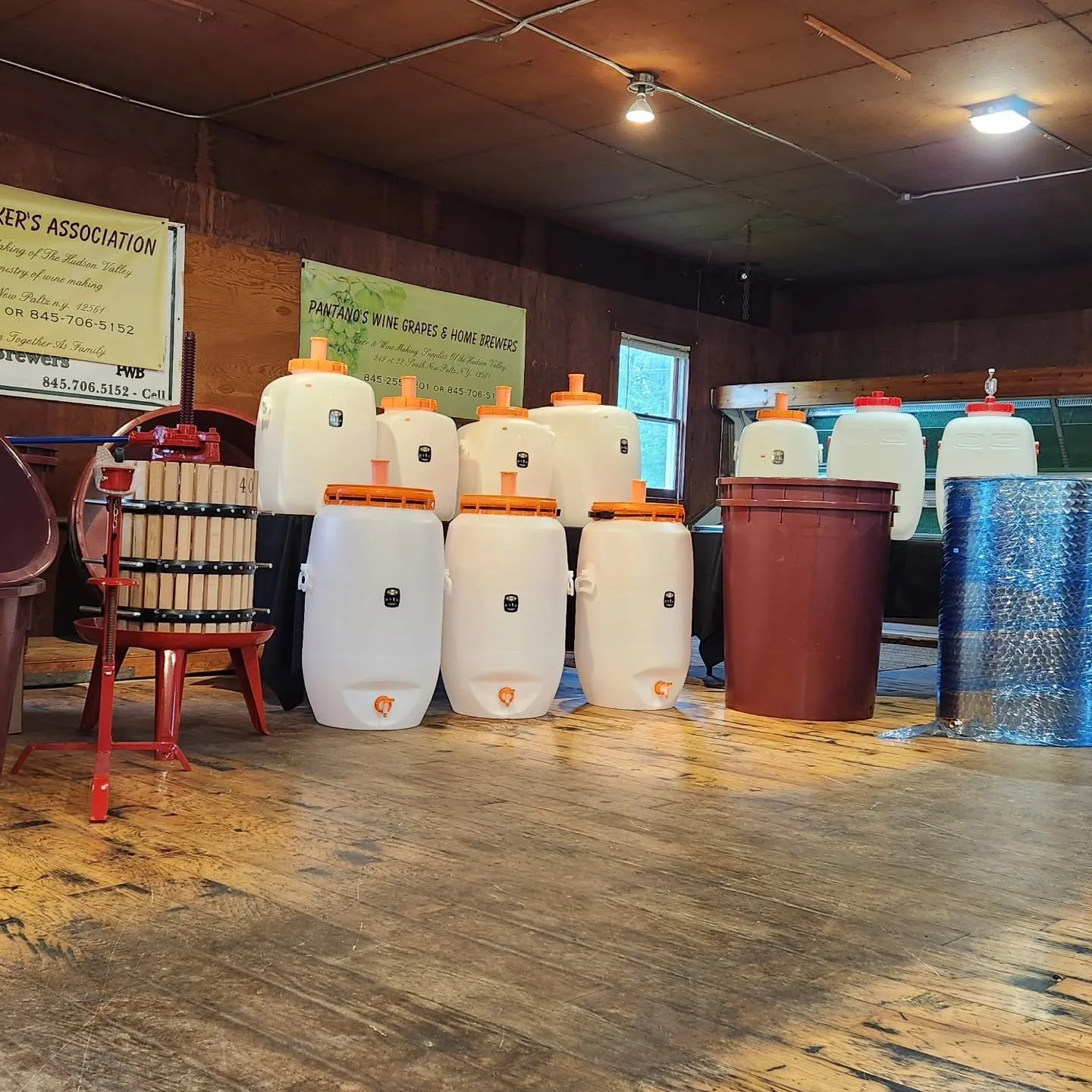 Carboys and fermentation containers inside Pantano's shop