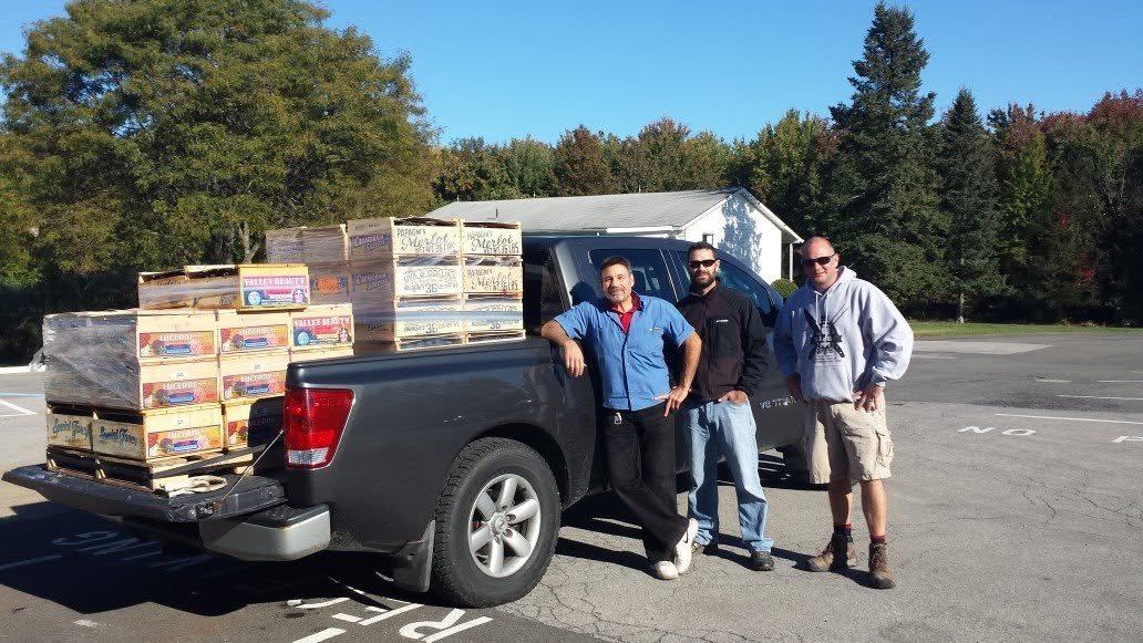 Jerry Pantano and customers with a fresh delivery outside the shop