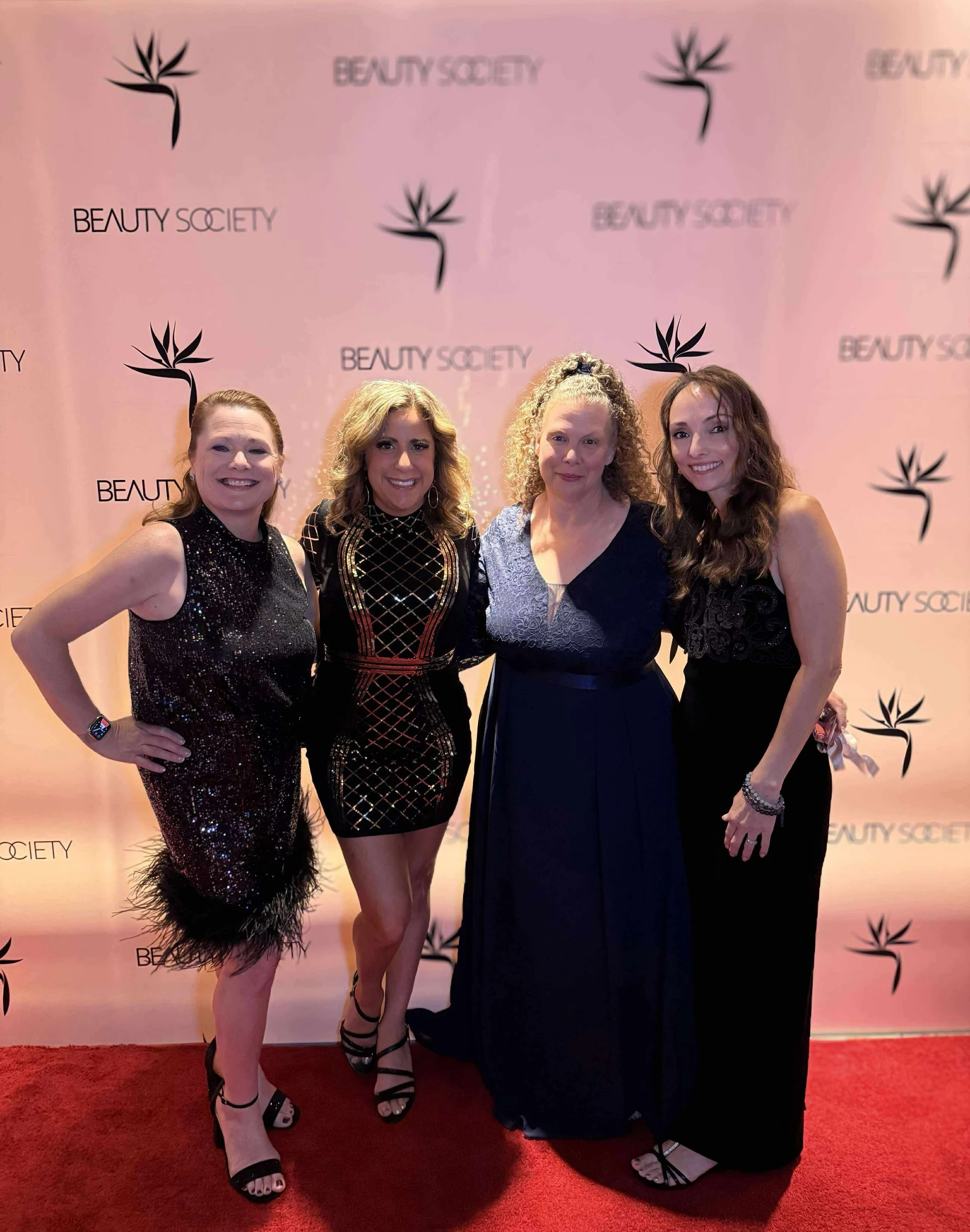 Emily Seagren with Beauty Society team members at the 2025 beauty convention in Las Vegas, Nevada.