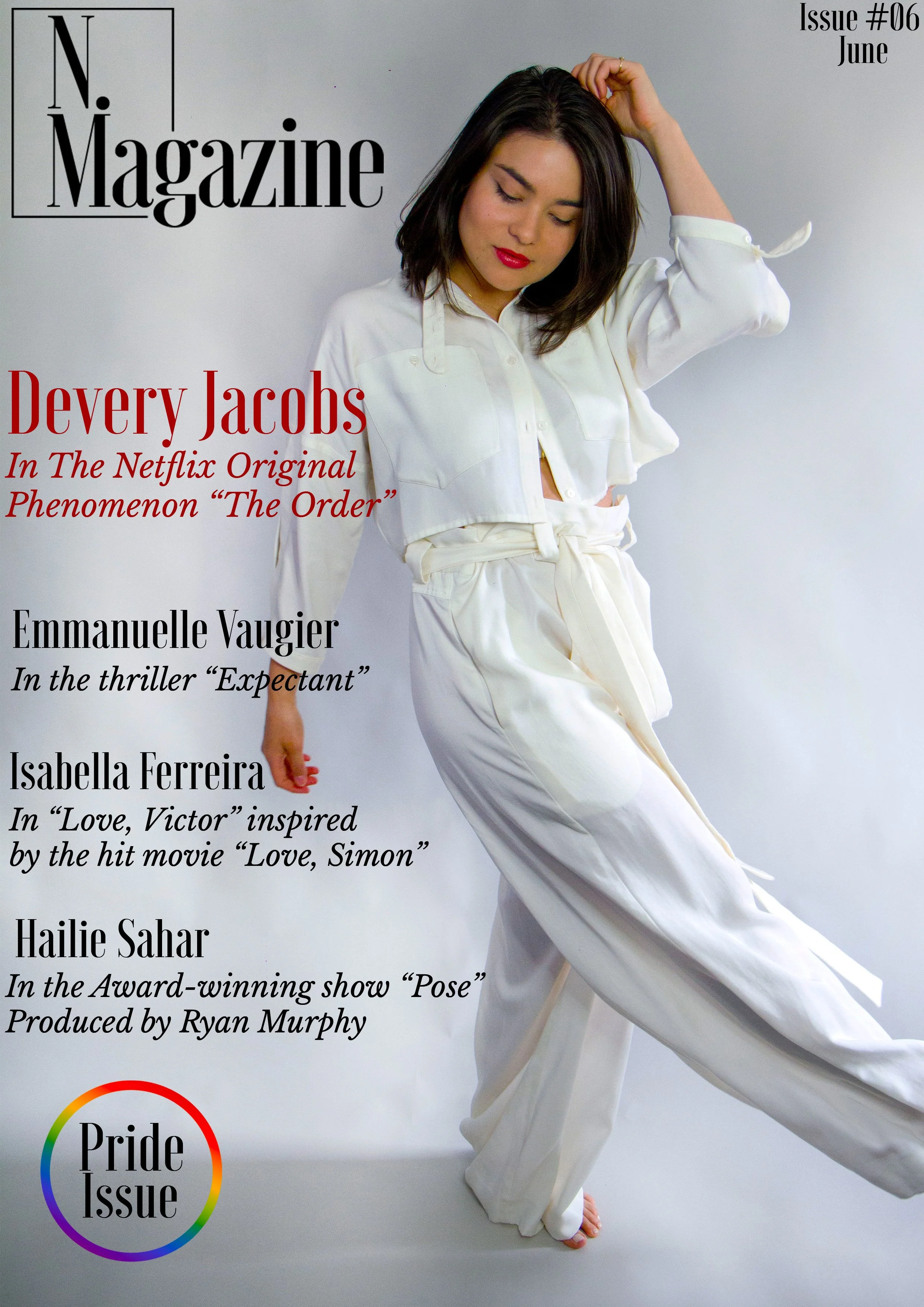 Cover of N. Magazine, June issue, featuring a woman with shoulder-length dark hair, wearing a white outfit, with her eyes closed and hand on her head, standing on a white background. The magazine covers topics on Devery Jacobs, Emmanuelle Vaugier, Is