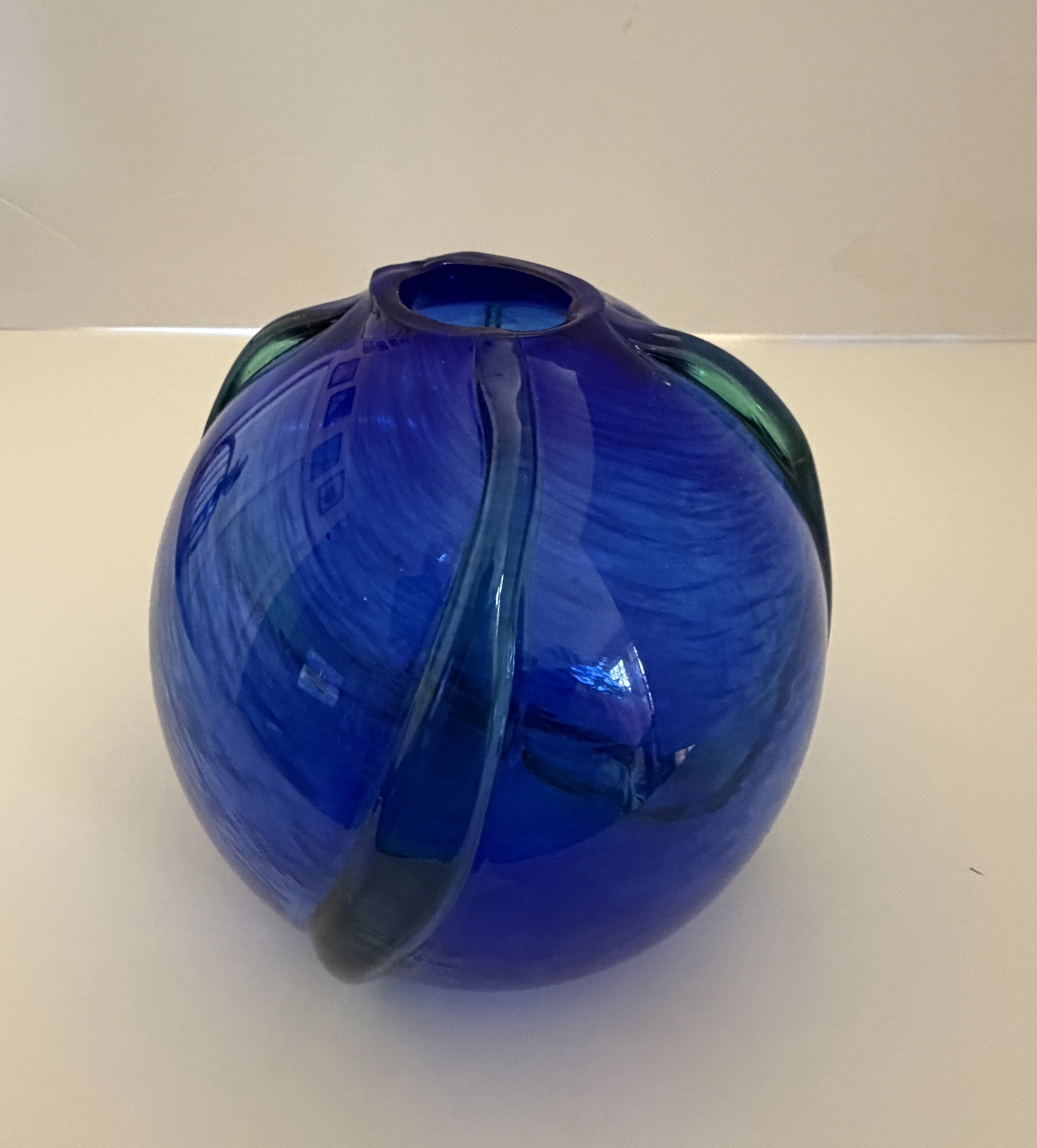 Handblown glass vase, Cobalt blue orb with applied green trails.