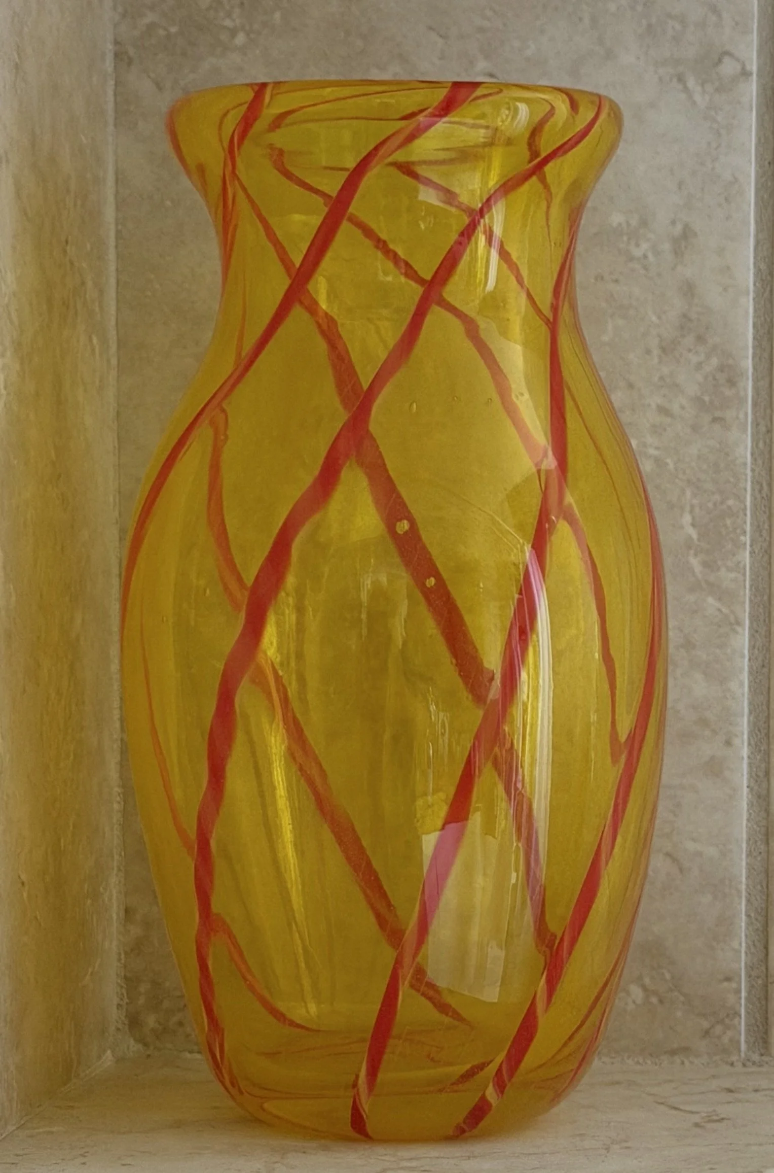 Handblown glass vase: Yellow with orange stripes.