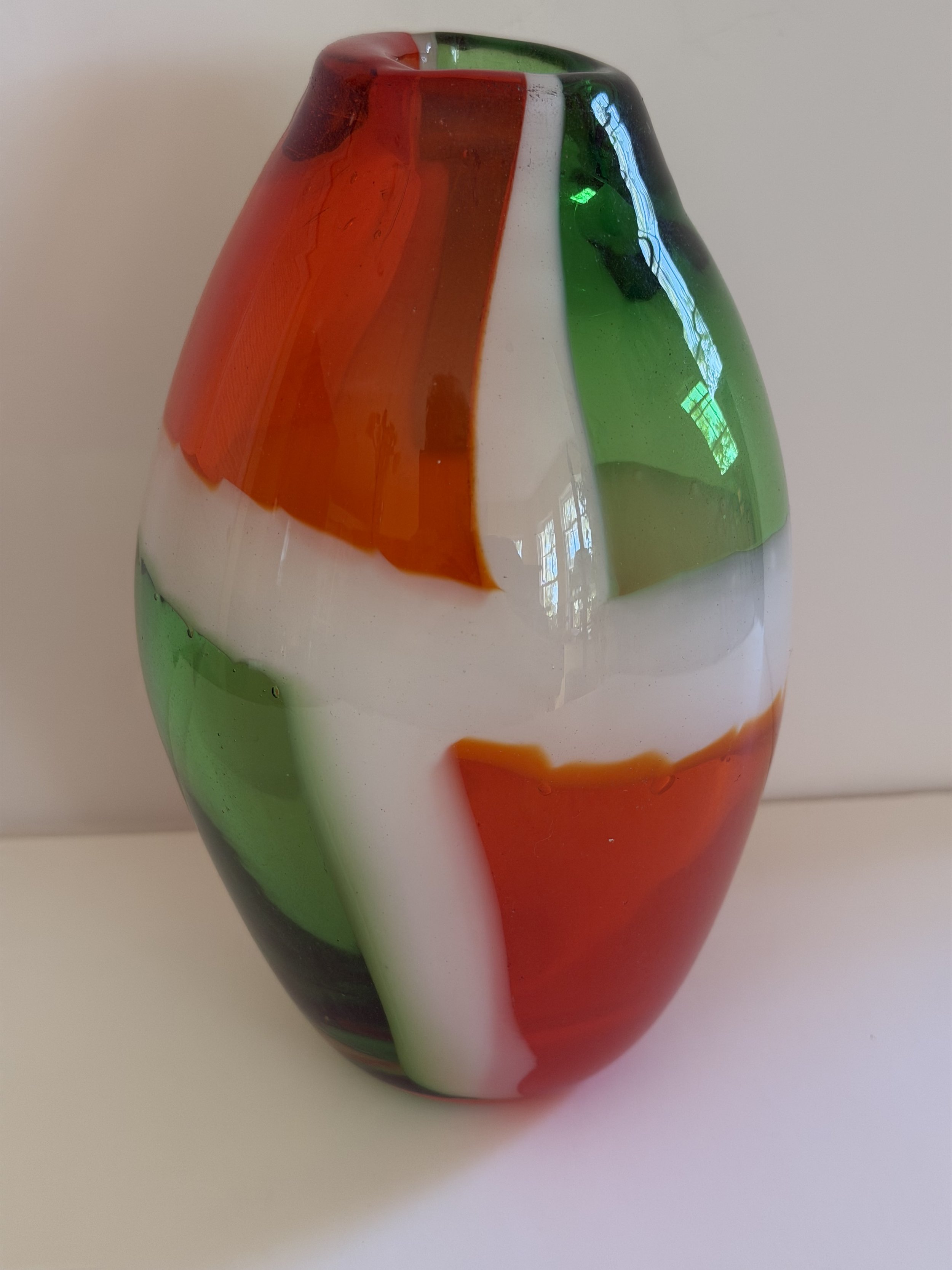 Handblown glass vase, Transparent orange and green with white borders.